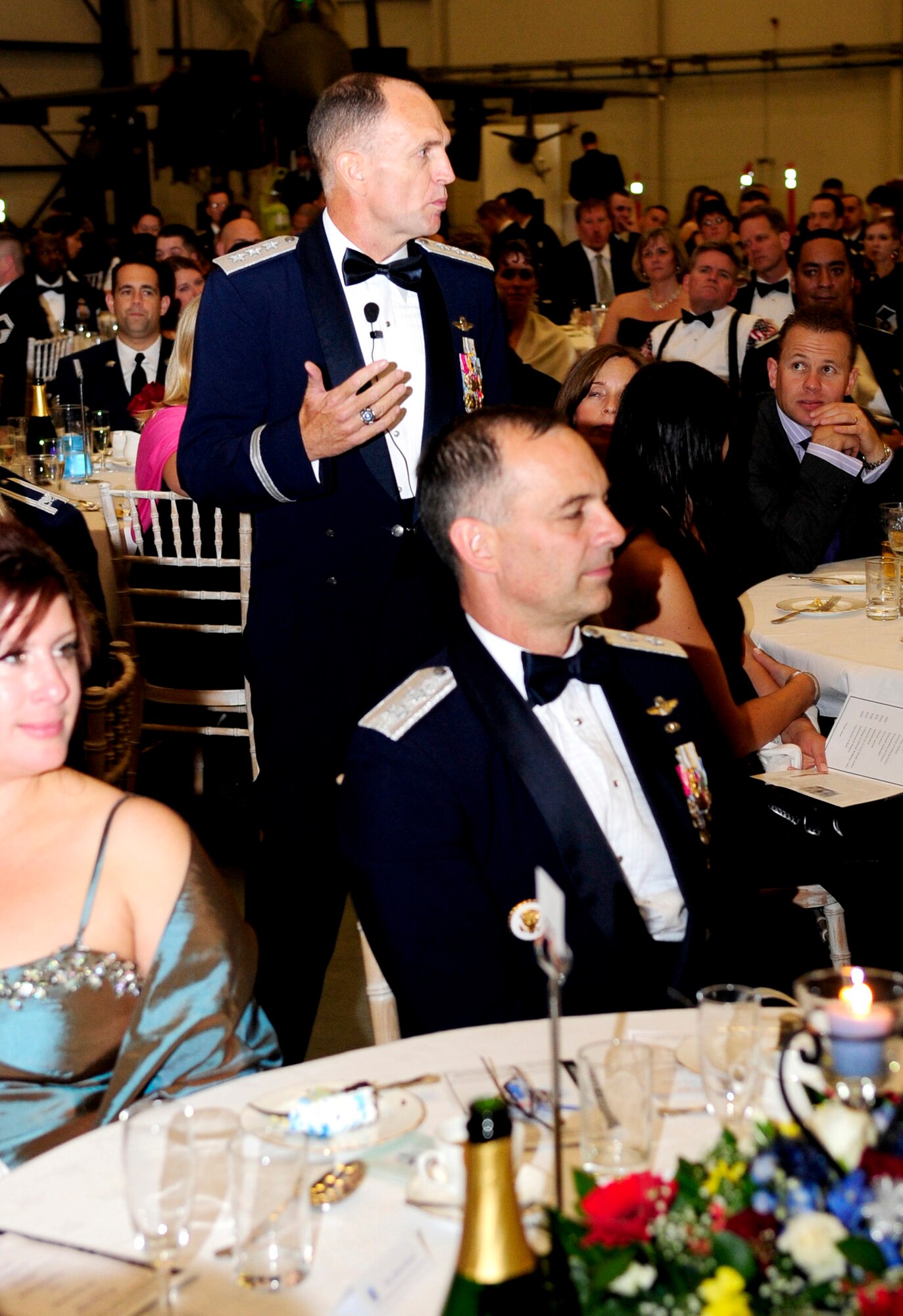 RAF MILDENHALL, England – Lt. Gen. Ralph J. Jodice II, Commander, Allied Air Component Command Headquarters and 16th Air Expeditionary Task Force, Izmir, Turkey, walks through the crowd as he talks about the importance of international relations when interacting with people from other nations. General Jodice was the guest speaker at the Air Force Ball Sept. 11 held in Hanger 814. (U.S. Air Force photo/Senior Airman Ethan Morgan) 