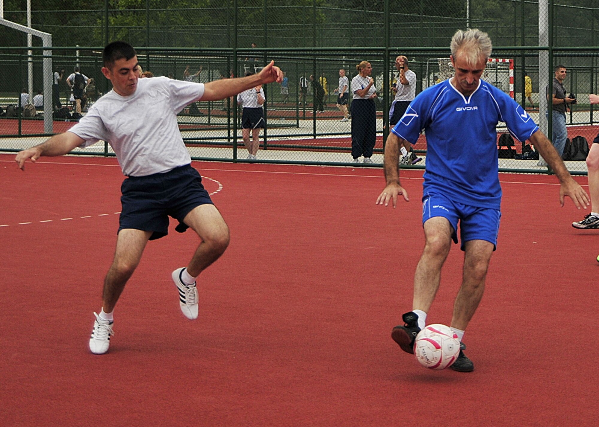 U.S. Air Force Staff Sgt. Kerim Kodal, a radiology technologist from the 48th Medical Surgical Operations Squadron at RAF Lakenheath, England, seeks opportunity to steal the ball from Montenegrin Armed Forces Lt. Col. Marinko Slomo during a soccer game for the MEDCEUR10 sports day at Danilovgrad Army Base, Montenegro, Sept. 12. Fitness is an intregal part of any military force and will help the armed forces during MEDCEUR10, a medical training exercise in central and eastern Europe. For more information, go to www.usafe.af.mil/medceur.asp and www.odbrana.gov.me. (U.S. Air Force photo/Airman 1st Class Tiffany Deuel)
