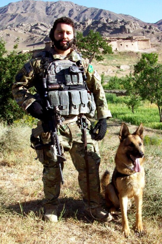 SHINKAY, Afghanistan - Staff Sgt. Eric Barrios, dog handler with the 36th Security Forces Squadron, recently received a Combat Action Medal for his actions during an ambush on his patrol team while deployed with U.S. Army Special Forces, 3rd Special Forces Group, Operational Detachment Alpha out of Fort Bragg, NC. After the engagement, Sergeant Barrios and his military working dog, Rex, recovered a small weapons cache of five AK-47’s, an ammunition vest containing 200 rounds, and a bag of six RPG rockets. (U.S. Air Force Courtesy Photo)


