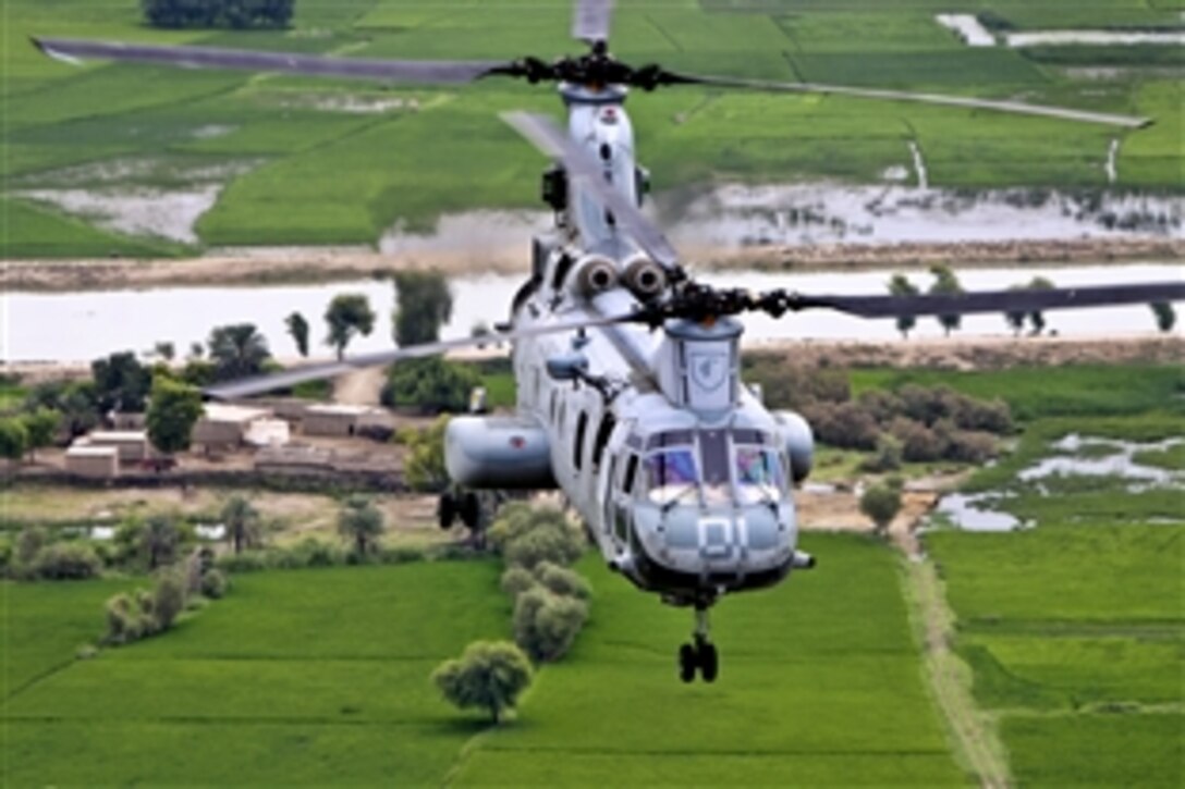 A U.S. Marine CH-46E Sea Knight helicopter flies to deliver supplies to flood victims during humanitarian assistance efforts in southern Pakistan, Sept. 11, 2010. The Marines are assigned to Marine Medium Helicopter Squadron 165, 15th Marine Expeditionary Unit.