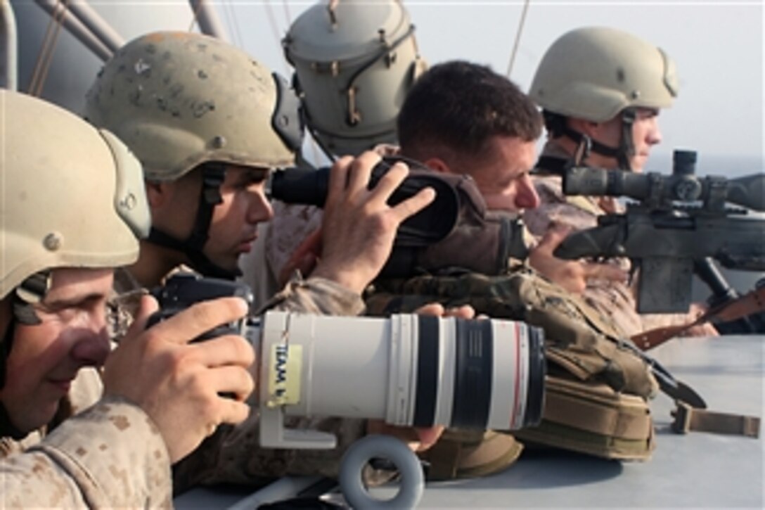 U.S. Marine Corps snipers provide cover and observation during a boarding and seizure operation to recover the motor vessel Magellan Star from suspected pirates who took control of the ship in the Gulf of Aden on Sept. 9, 2010.  Marines assigned to the 15th Marine Expeditionary Unit’s Maritime Raid Force boarded the vessel and took nine suspected pirates into custody.  The pirates were taken to the guided missile cruiser USS Princeton (CG 59) and the Magellan Star’s 11 crewmembers resumed control of the container ship.  
