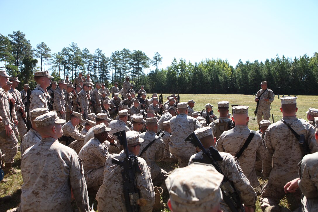 Staff Sgt. Nicholas J. DiRoma, the range safety officer, gives a safety brief to the Marines of Echo Company at the 6N Hand Grenade Qualification Course Range, recently. Echo is just one company in 2nd Battalion, 8th Marine Regiment that is going through pre-deployment training, here.  During the brief, Marines learned the correct way to handle and employ the M69 practice grenade.