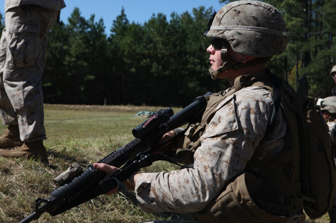 Lance Cpl. Sam S. Skupien, an assaultman with Weapons Platoon, looks downrange before he moves up to the firing line to toss practice grenades at the 6N Hand Grenade Qualification Course Range, here, recently.  The Export, Pa. native, has been in the Marine Corps just under a year and is training for his first deployment.