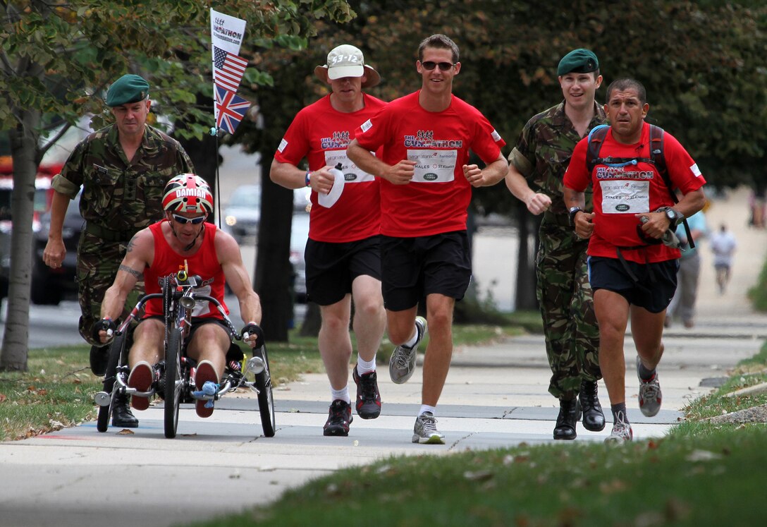 Four of the six Gumpathon runners run up Massachusetts Ave. NW in their final push to the British Embassy with two Royal Marine Commandos, Sept. 14, 2010. The Gumpathon is a fundraiser aimed toward earning $1 million for three separate charities supporting the well-being of American and British wounded warriors.