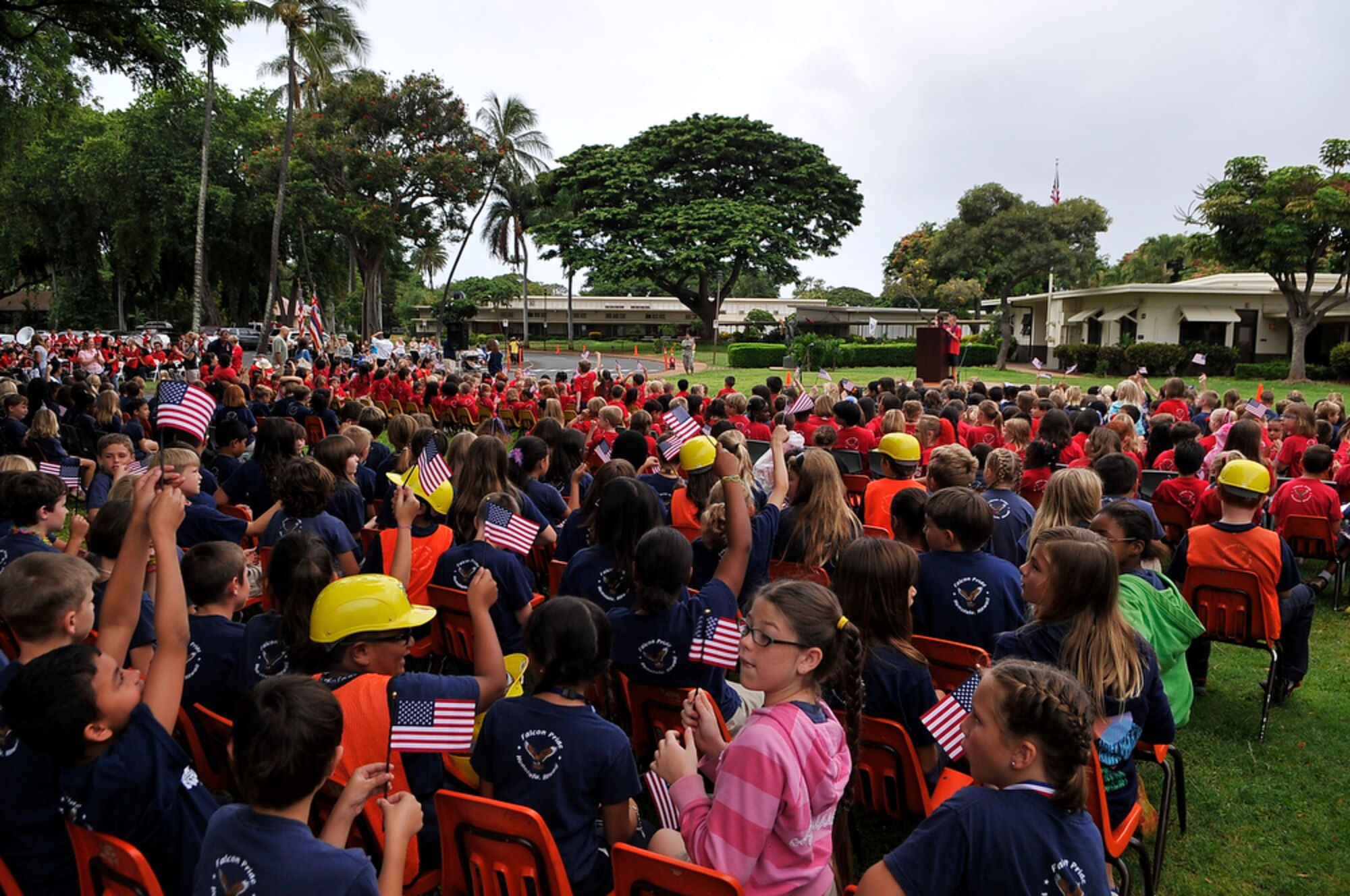 JOINT BASE PEARL HARBOR-HICKAM, Hawaii - More than 750 students from Hickam Elementary School on Joint Base Pearl Harbor-Hickam, Hawaii wave their flags and listen to their class presidents during the school's second annual 9/11 Observance Ceremony. (U.S.  Air Force photo/Tech Sgt. Cohen A. Young)