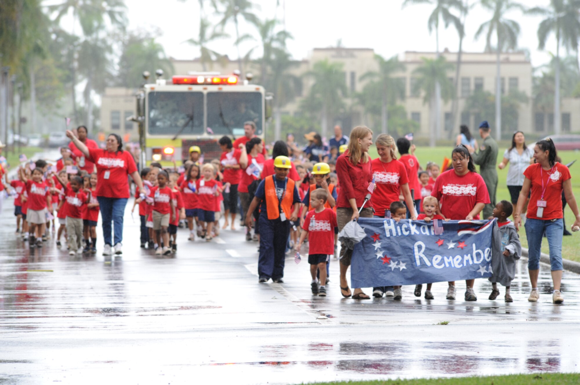 JOINT BASE PEARL HARBOR-HICKAM, Hawaii - Kindergarteners and their teachers from Hickam Elementary School, Joint Base Pear Harbor-Hickam, Hawaii conduct their own parade in the rain on Sept. 10 as part of their Second Annual 9/11 Observance Ceremony. More than 750 students from Hickam Elementary participated in the ceremony with the help of their teachers, parents and the Radford High School Color Guard and Band. (U.S.  Air Force photo/Tech Sgt. Cohen A. Young)