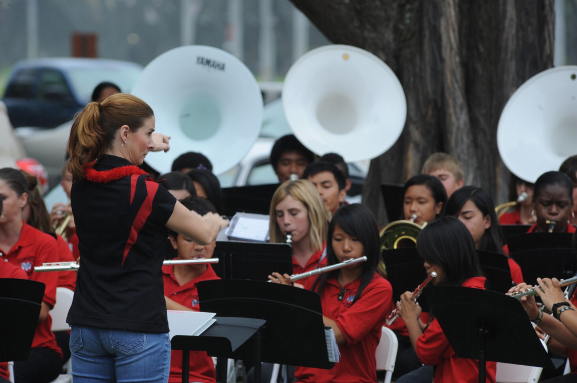JOINT BASE PEARL HARBOR-HICKAM, Hawaii - Band Director, Nicole Sherlock leads the Radford High School Band in playing the National Anthem during a 9/11 Ceremony at Hickam Elementary School, Joint Base Pear Harbor-Hickam, Hawaii on Sept. 10. More than 750 students from Hickam Elementary School  with the help of their teachers, parents and the Radford Band took time to remember those that were killed as a result of several terrorists acts on Sept. 11, 2001. (U.S.  Air Force photo/Tech Sgt. Cohen A. Young)