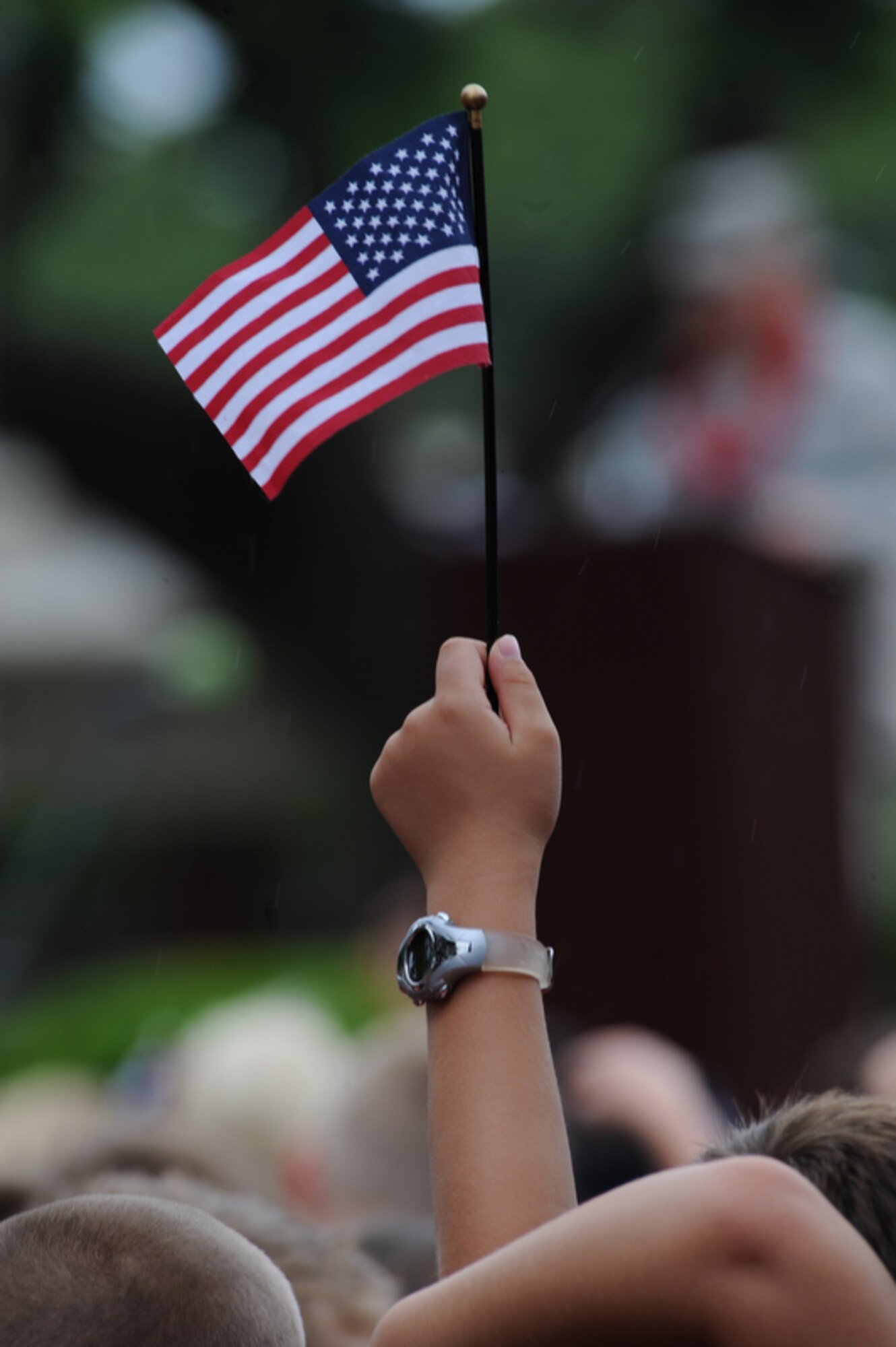 JOINT BASE PEARL HARBOR-HICKAM, Hawaii - A student from Hickam Elementary School holds his flag proudly on Sept. 10 during a 9/11 Ceremony on Joint Base Pearl Harbor-Hickam, Hawaii. This is the school's second year paying respect to the victims of the Sept. 11 terrorist attacks that devastated the United States nine years ago. (U.S.  Air Force photo/Tech Sgt. Cohen A. Young)