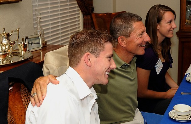 Cadet 1st Class Eric Prince, left, and Cadet 2nd Class Rachel Reeder, right, sit next to Lt. Gen. Mike Gould during a dinner for Aces List recipients at the Air Force Academy Sept. 9, 2010. The Aces List comprises cadets who maintained a 4.0 grade point average during the previous semester. General Gould is the Academy superintendent. (U.S. Air Force photo/Rachel Boettcher)