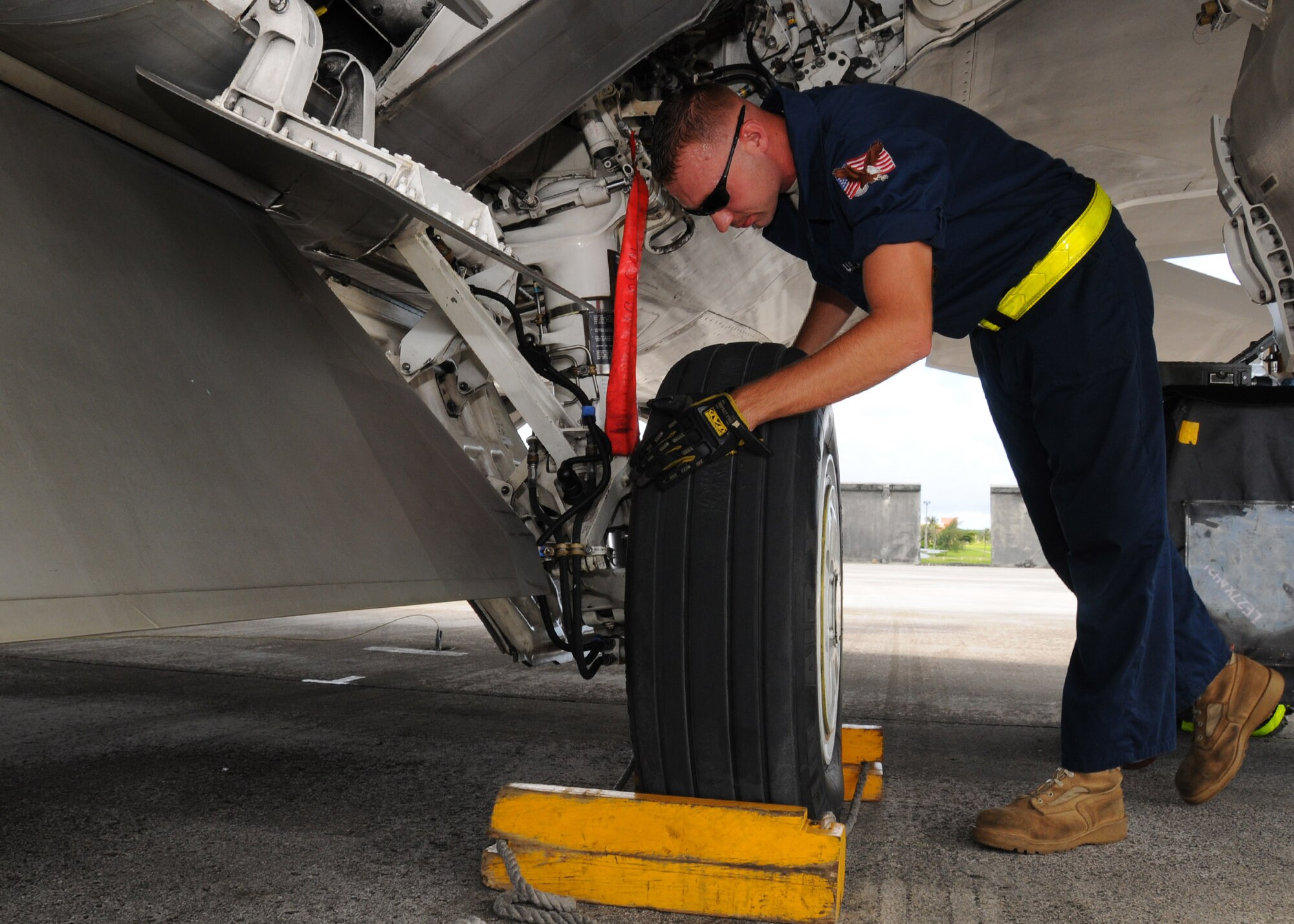 ANDERSEN AIR FORCE BASE, Guam - Staff Sgt. Jesse Buettner, 36th Expeditionary Aircraft Maintenance Squadron, crew chief conducts a thorough flight inspection after arrival here Sept. 13. The maintenance Airmen are vital part of the exercise, Valiant Shield 2010, keeping the aircraft in flight. More than 150 aircraft will participate in Valiant Shield, including, B-52 Stratofortresses, F-15 Eagles, F-15E Strike Eagles, E-3 Sentry airborne warning and control aircraft, KC-10 Extenders, KC-135 Stratotankers, P-3 Orions and F/A-18 Delta Hornets. More than 100 of the aircraft will fly from Andersen to conduct sorties in various exercise scenarios. Sergeant Buettner is deployed here from the 27th Air Maintenance Unit, Langley Air Force Base, Va. (U.S. Air Force photo by Senior Airman Nichelle Anderson)