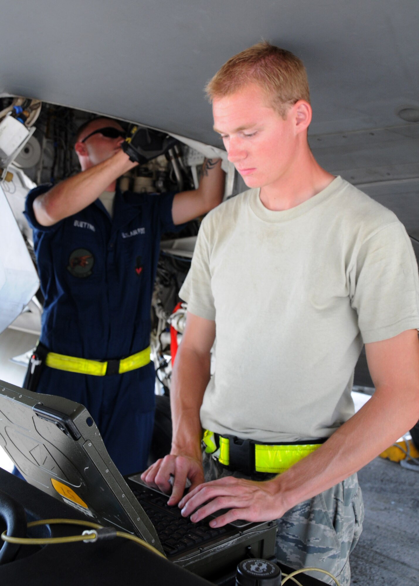 ANDERSEN AIR FORCE BASE, Guam - Staff Sgt. Jesse Buettner and Senior Airman Josh Dawson, 36th Expeditionary Aircraft Maintenance Squadron  crew chiefs, conduct a thorough flight inspection after arrival to here, Sept. 13. The maintenance Airmen are vital part of the exercise, Valiant Shield 2010, keeping the aircraft in flight. More than 150 aircraft will participate in Valiant Shield, including, B-52 Stratofortresses, F-15 Eagles, F-15E Strike Eagles, E-3 Sentry airborne warning and control aircraft, KC-10 Extenders, KC-135 Stratotankers, P-3 Orions and F/A-18 Delta Hornets. More than 100 of the aircraft will fly from Andersen to conduct sorties in various exercise scenarios. Sergeant Buettner and Airman Dawson are deployed here from the 27th Air Maintenance Unit, Langley Air Force Base, Va. (U.S. Air Force photo by Senior Airman Nichelle Anderson)