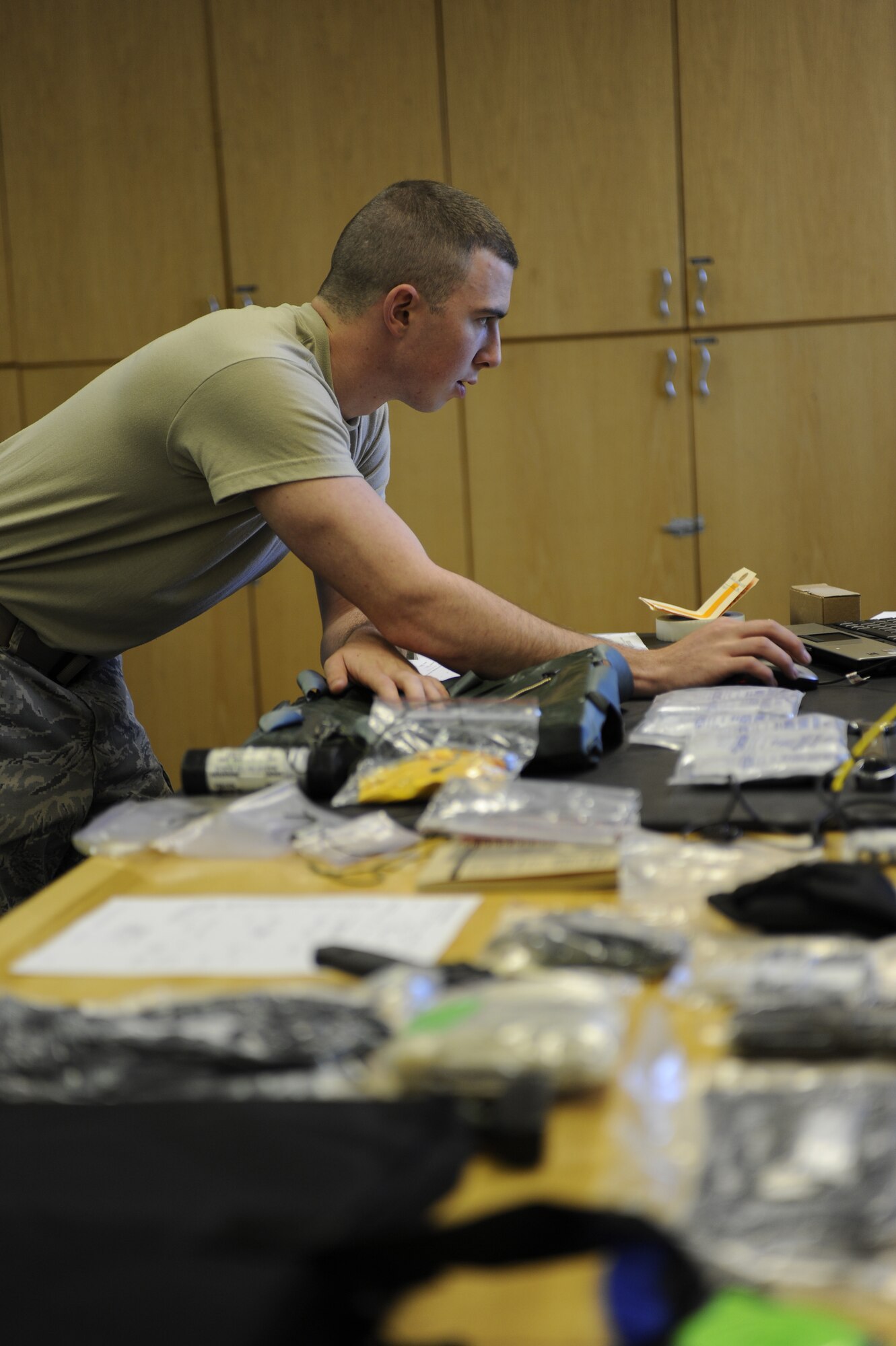Airman 1st Class Jerred Brown reviews technical orders Sept. 13, 2010, Eielson Air Force Base, Alaska. Every item must be accounted for and inspected routinely to ensure its quality and reliability. Airman Brown is an Aircrew Flight Equipment Apprentice assigned to the 354th Aircrew Flight Equipment. (U.S. Air Force photo/Senior Airman Willard E. Grande II)