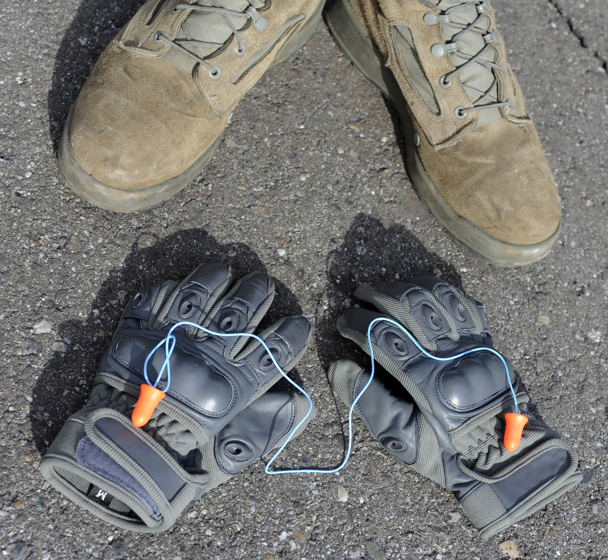 Personal protective equipment is necessary to ensure Airmen are safe as seen Sept. 9, 2010, Eielson Air Force Base, Alaska. The 354th Munitions Storage Flight always wears steel toe boots, ear protection, and hand protection when required. (U.S. Air Force photo/Senior Airman Willard E. Grande II)