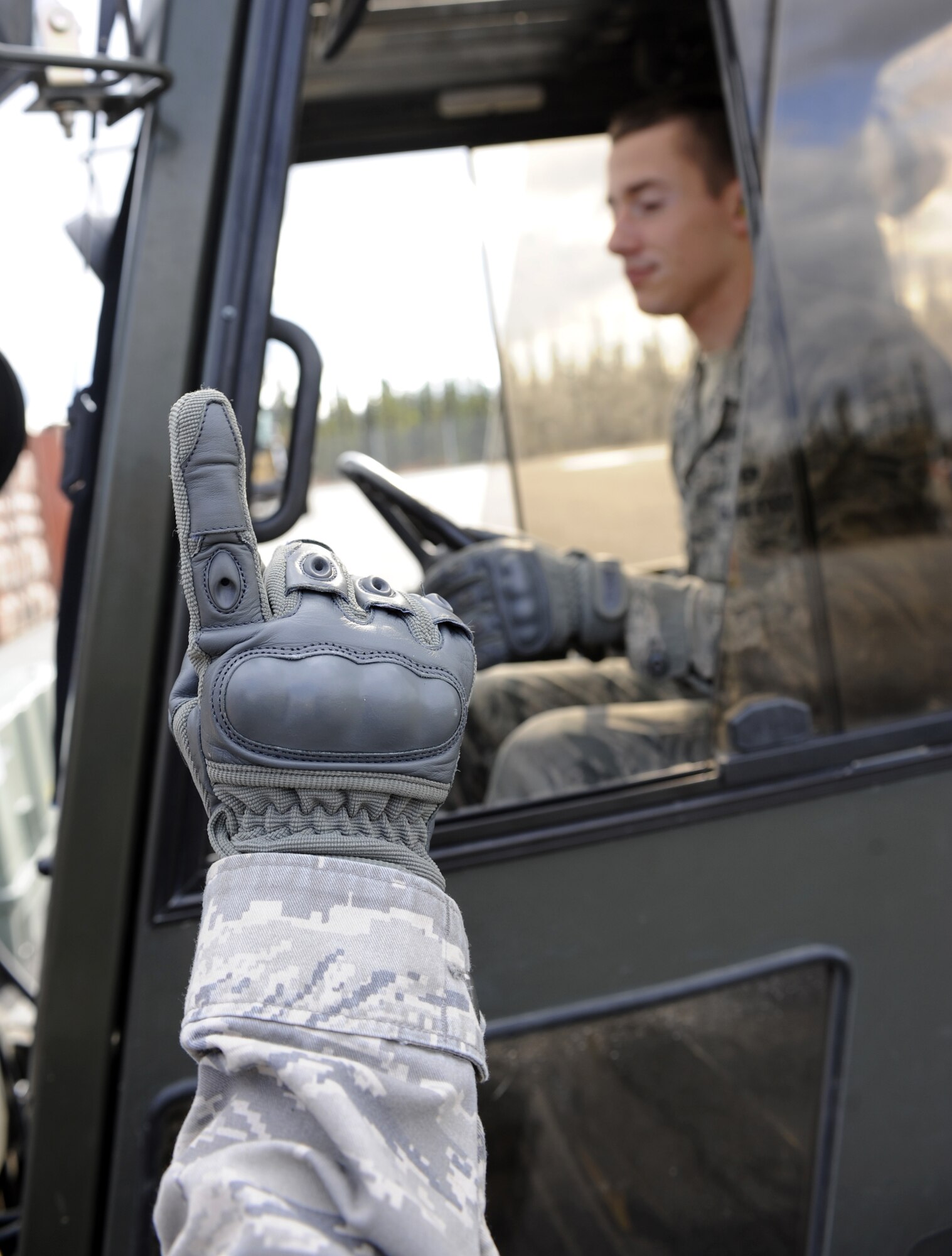 Airman 1st Class Christopher Lynch directs a forklift placing unserviceable munitions onto a pallet Sept. 9, 2010, Eielson Air Force Base, Alaska. This annual shipment is neatly packed into a shipping container then sent to a barge where unserviceable munitions are sent back to the lower 48. Airman Lynch is a crew member assigned to the 354th Munitions Storage Flight. (U.S. Air Force photo/Senior Airman Willard E. Grande II)