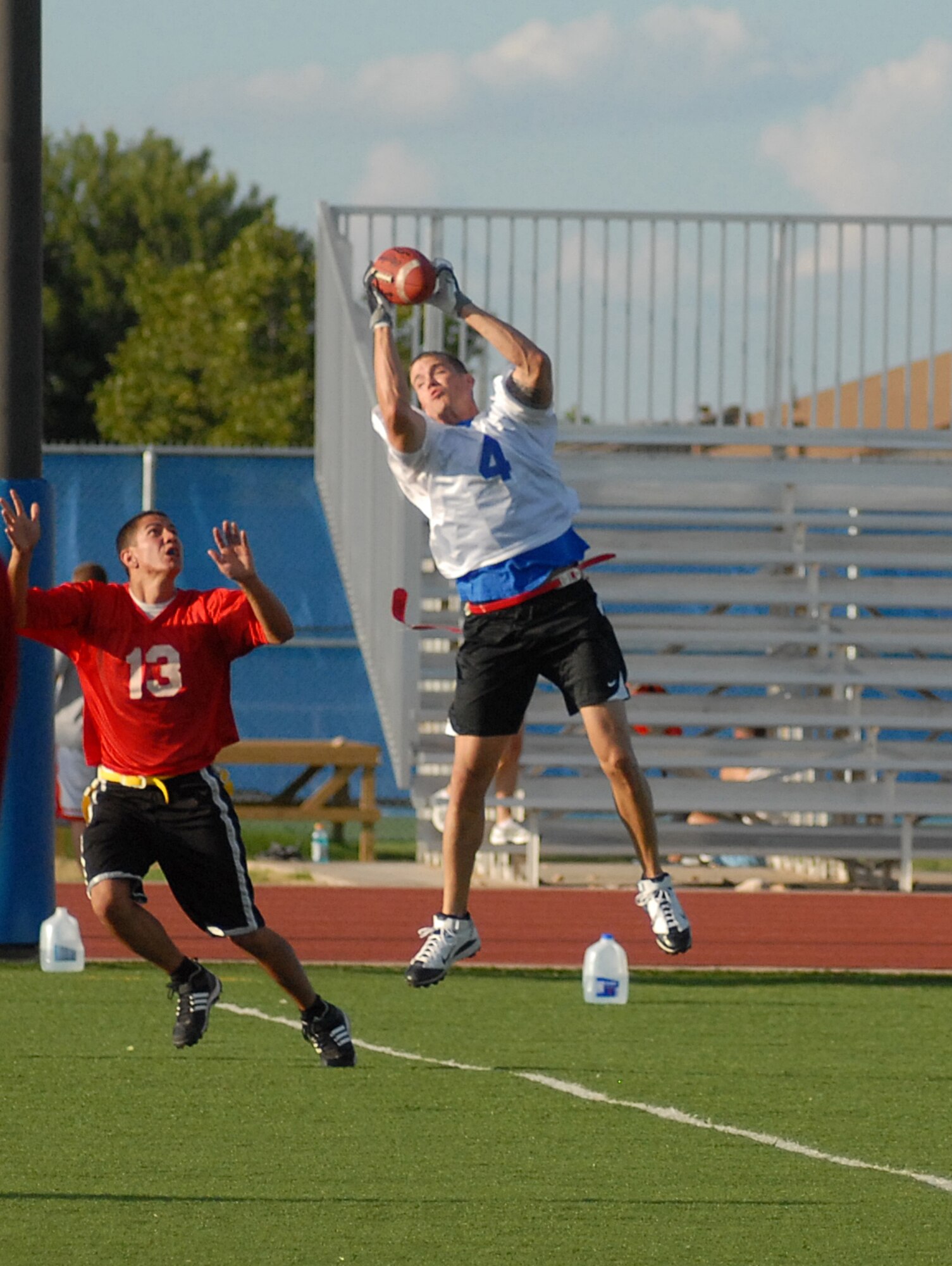 Robert Berry, 1st Responder, pulls in a high spiral during an intramural football game against the 17th Medical Group Cobras Sept. 13. 1st Responders defeated the Cobras 21-20. (U.S. Air Force photo/Connie Hempel)