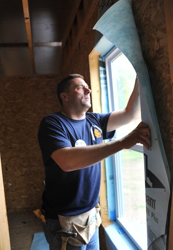 Tech Sgt. Tom Moore, of the 932nd Medical Squadron, helps build a new house for Habitat for Humanity in St. Louis, MO.  Sergeant Moore and other members of the  932nd Airlift Wing Rising Six organization volunteered for the construction project.   The 932nd AW is an Air Force Reserve unit based at Scott AFB, IL. (U.S. Air Force photo/Tech. Sgt. Christopher Parr)  