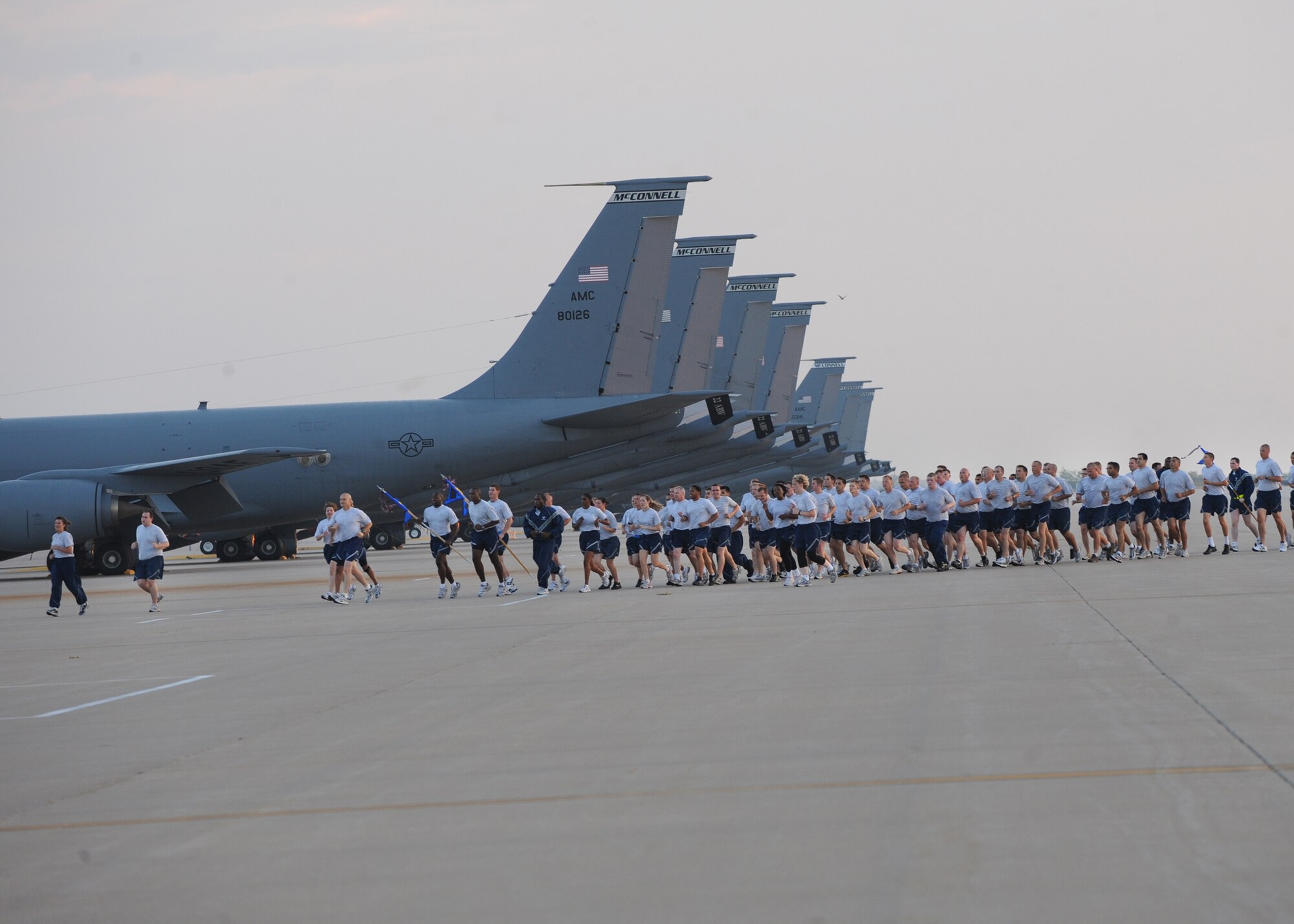 Team McConnell Airmen run past McConnell’s KC-135 Stratotankers during a Patriot Day Fun Run Sept. 10, 2010, McConnell Air Force Base, Kan.  The run was held in honor of those who lost their lives during the Sept. 11, 2001, terrorist attacks.  The wing ran approximately 2 miles at a 10 minute-mile pace starting from the fitness center to McConnell’s flightline and back. (U.S. Air Force photo/Airman 1st Class Andrea Salazar)