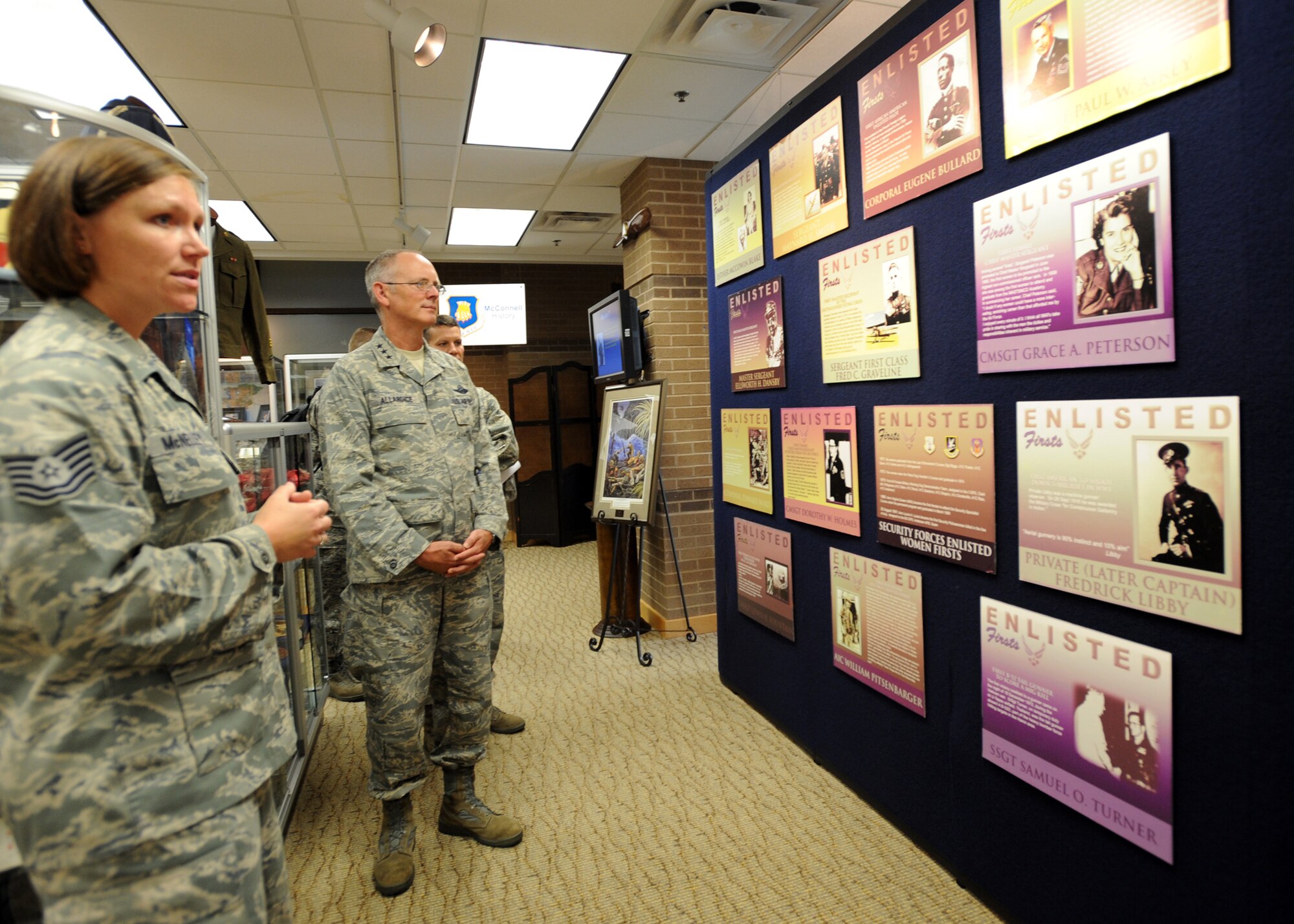 Tech. Sgt. Rebecca McNelley, 22nd Force Support Squadron Airman Leadership School instructor, gives Lt. Gen. Robert Allardice, 18th Air Force commander, a tour of McConnell’s Enlisted Heritage Hall inside the Robert J. Dole Community Center Sept. 8, 2010, McConnell Air Force Base, Kan.  The Enlisted Heritage Hall educates visitors with stories of contributions made by the Air Force’s enlisted force. (U.S. Air Force photo/Airman 1st Class Andrea Salazar)