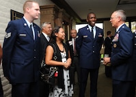 Lt. Gen. Robert Allardice, 18th Air Force commander, thanks Staff Sgt. Jonathan Cissna, 22nd Communications Squadron communication focal point technician, his wife Jona and Senior Airman Steven Jones, 22nd Aircraft Maintenance Squadron crew chief, for their contributions to the Air Mobility Command during a dinner titled “Ordinary Airmen, Extraordinary Actions,” at the Crestview Country Club, Sept. 8, 2010, Wichita, Kan.  The 18th Air Force commander visited McConnell Sept. 8 through 9, and met with Airmen to show his appreciation for their work, particularly their contributions to Air Mobility Command. (U.S. Air Force photo/Airman 1st Class Andrea Salazar)
