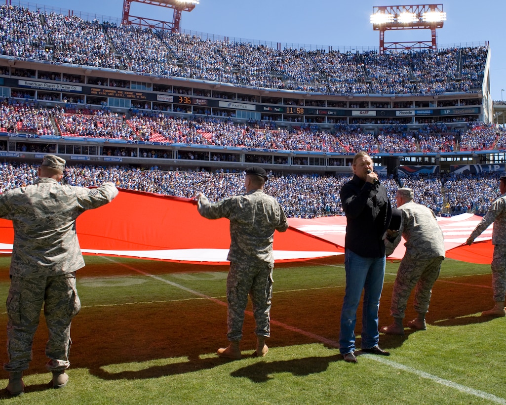 Country music star Trace Adkins, sings the national anthem in front of more than 140 Tennessee National Guard Soldiers and Airmen to kickoff the first game of the Titans season, Sept. 12.