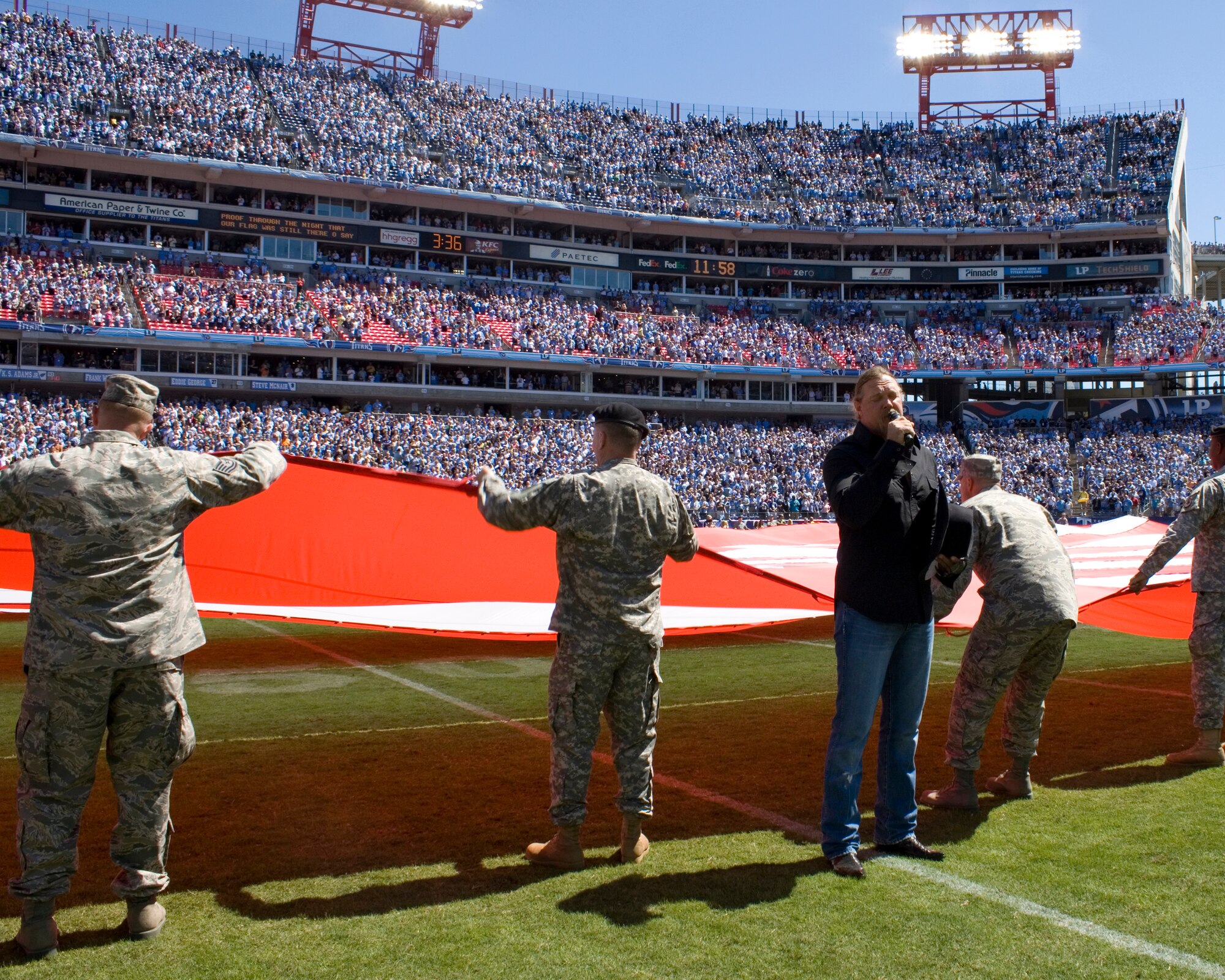 Country music star Trace Adkins, sings the national anthem in front of more than 140 Tennessee National Guard Soldiers and Airmen to kickoff the first game of the Titans season, Sept. 12.