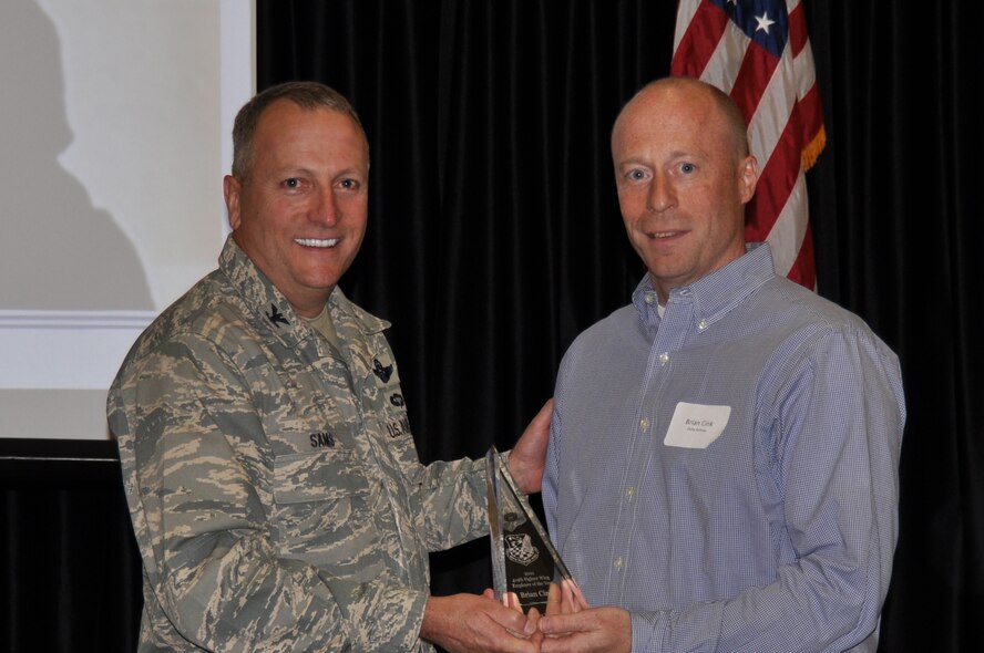 Col. Walter “Buck” Sams, 419th Fighter Wing commander, presents the 2010 Employer of the Year award to Mr. Brian Cink, a supervisor at Delta Airlines, during the wing’s annual Employer Appreciation Day. Mr. Cink supervises six 419th FW pilots. (U.S. Air Force photo/Staff Sgt. Alan Schultz)