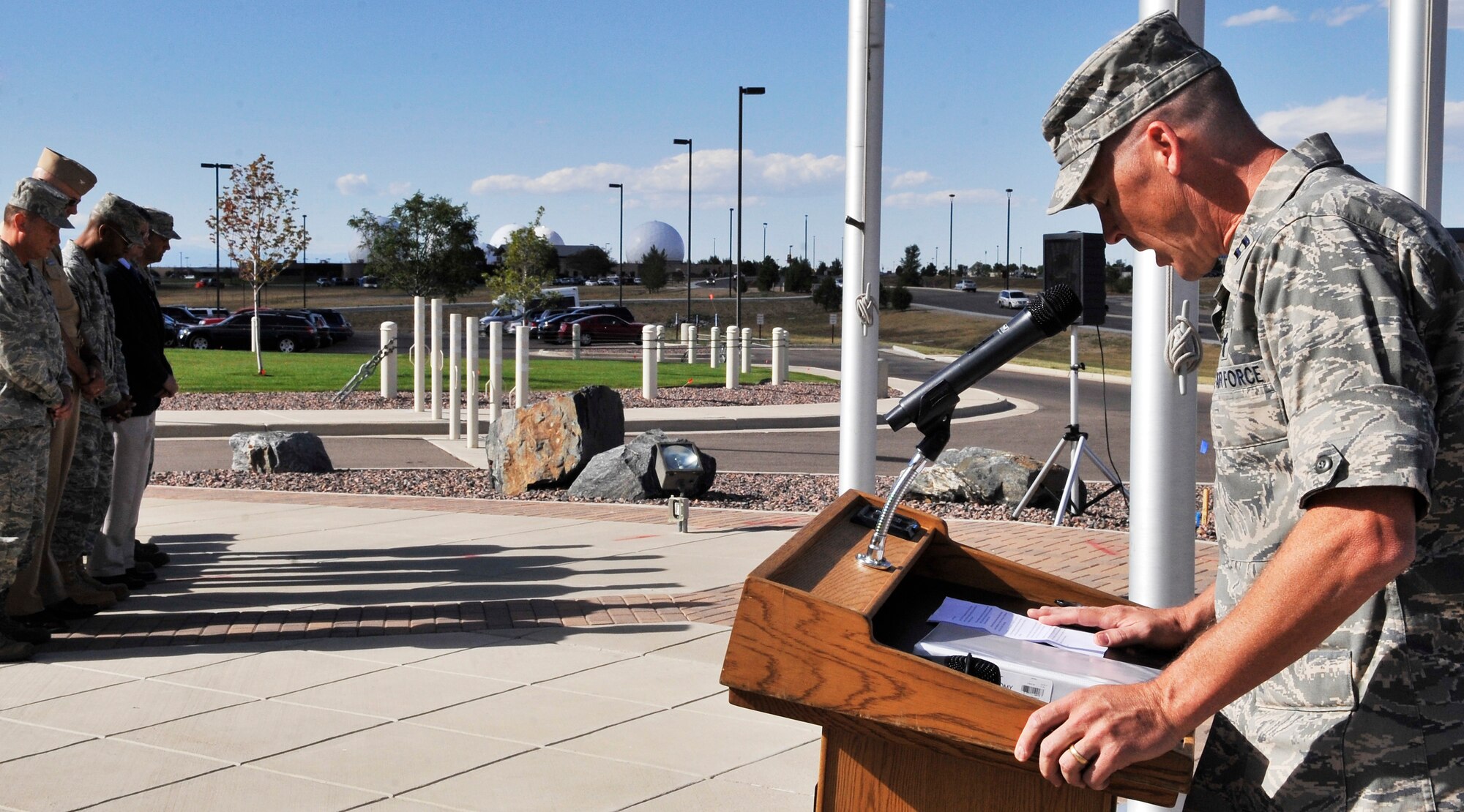 BUCKLEY AIR FORCE BASE, Colo. -- Capt. Randy Croft, 460th Space Wing Chaplain, gives the invocation during a Patriot Day ceremony.The United States flag was lowered to half-staff in remembrance of the lives lost in 2001. (U.S. Air Force photo by Airman 1st Class Paul Labbe)

