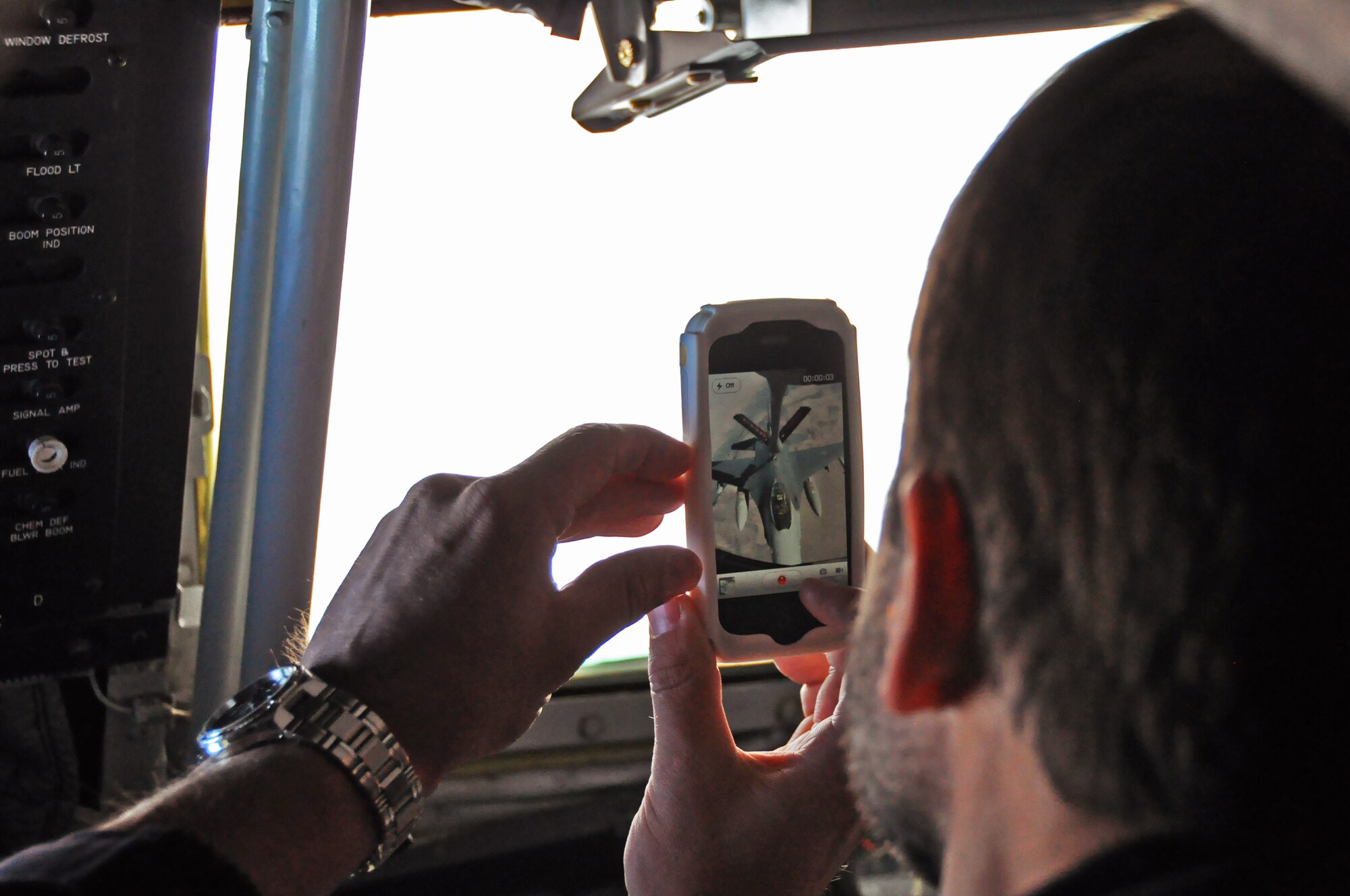 Dr. Sonny Hollingworth, a physician, captures video footage of an F-16 aerial refueling mission from the back of a KC-135 Stratotanker. The tanker flight was part of the 419th Fighter Wing’s Employer Appreciation Day Sep. 11. (U.S. Air Force photo/Staff Sgt. Alan Schultz)