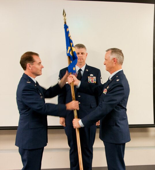 In an assumption of command, Lt. Col. Kurt Westfall (right), takes command of the Operations Support Flight, on Saturday, September 11, 2010, 139th Airlift Wing, Missouri Air National Guard, St. Joseph, Mo. (U.S. Air Force photo by Airman 1st Class Kelsey Stuart) (RELEASED)