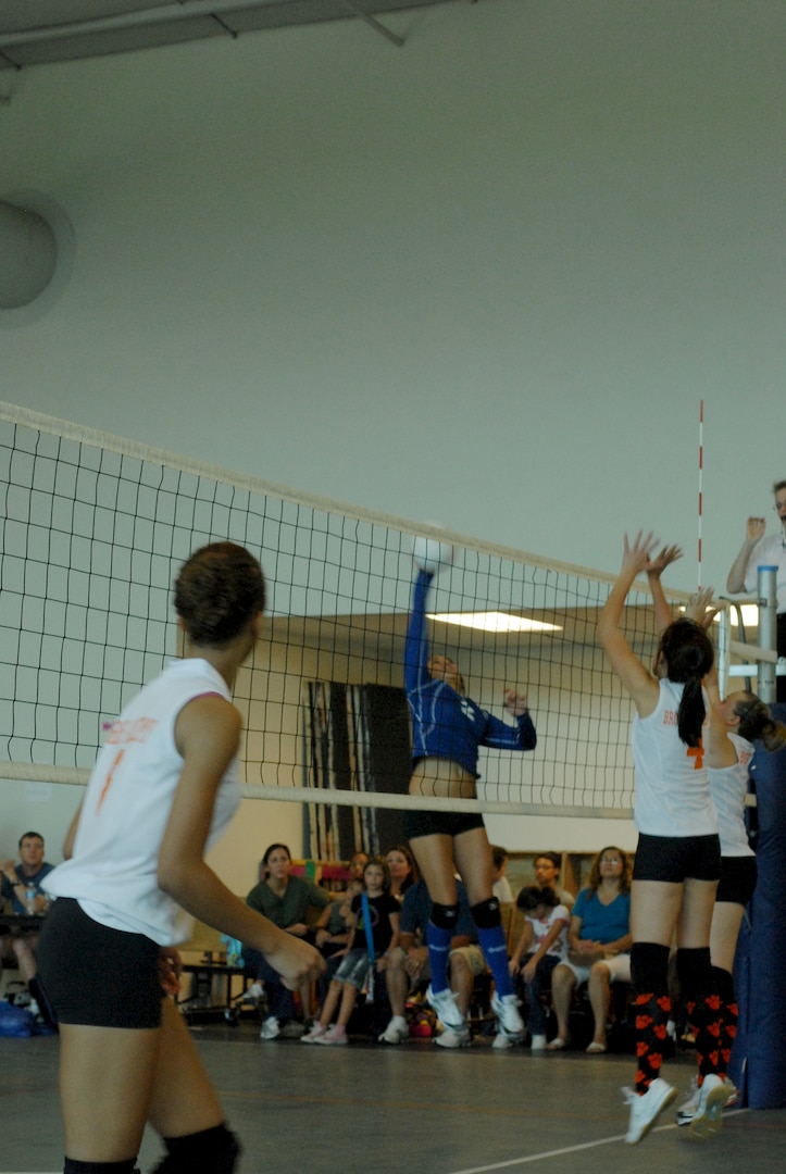 Randolph High School Ro-Hawks play Brooks Academy, beating them with a final score of 4-1. The Ro-Hawks are nealy unbeaten with a 6-1 record so far. Senior Megan Romero blocks a Bengal kill. (U.S. Air Force Photo/Brian McGloin)