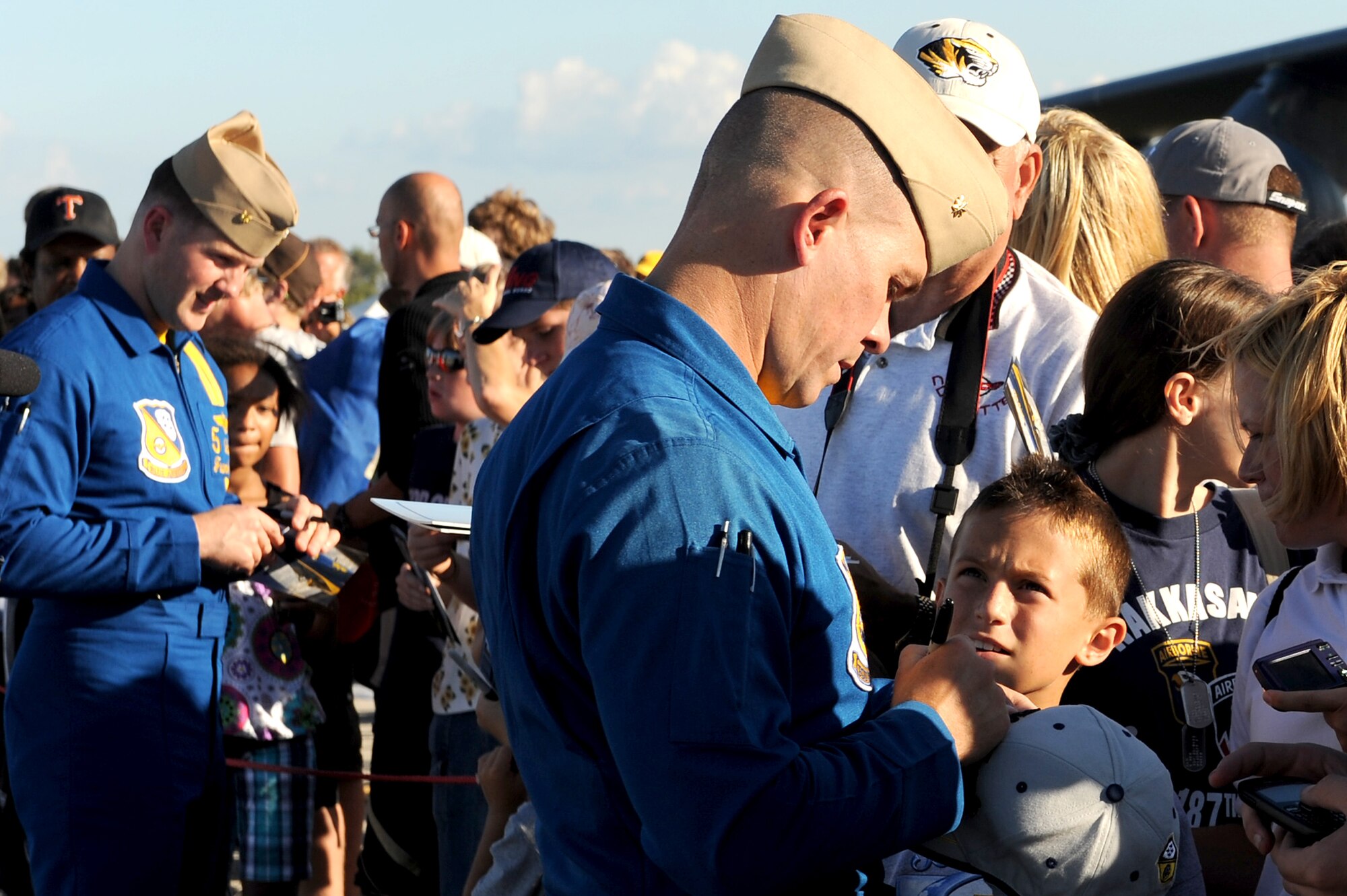 The Navy Blue Angels pilots take time to sign autographs and meet with the crowd after their performance during the 2010 Airpower Over the Midwest Air Show held Sept. 11 at Scott AFB. Other headlining acts included the Army Golden Knights Parachute Team and the Tora! Tora! Tora!, a reenactment of the Dec. 7, 1941 attack on Pearl Harbor with pyrotechnic explosions. (U.S. Air Force photo by Staff Sgt. Brian J. Valencia)