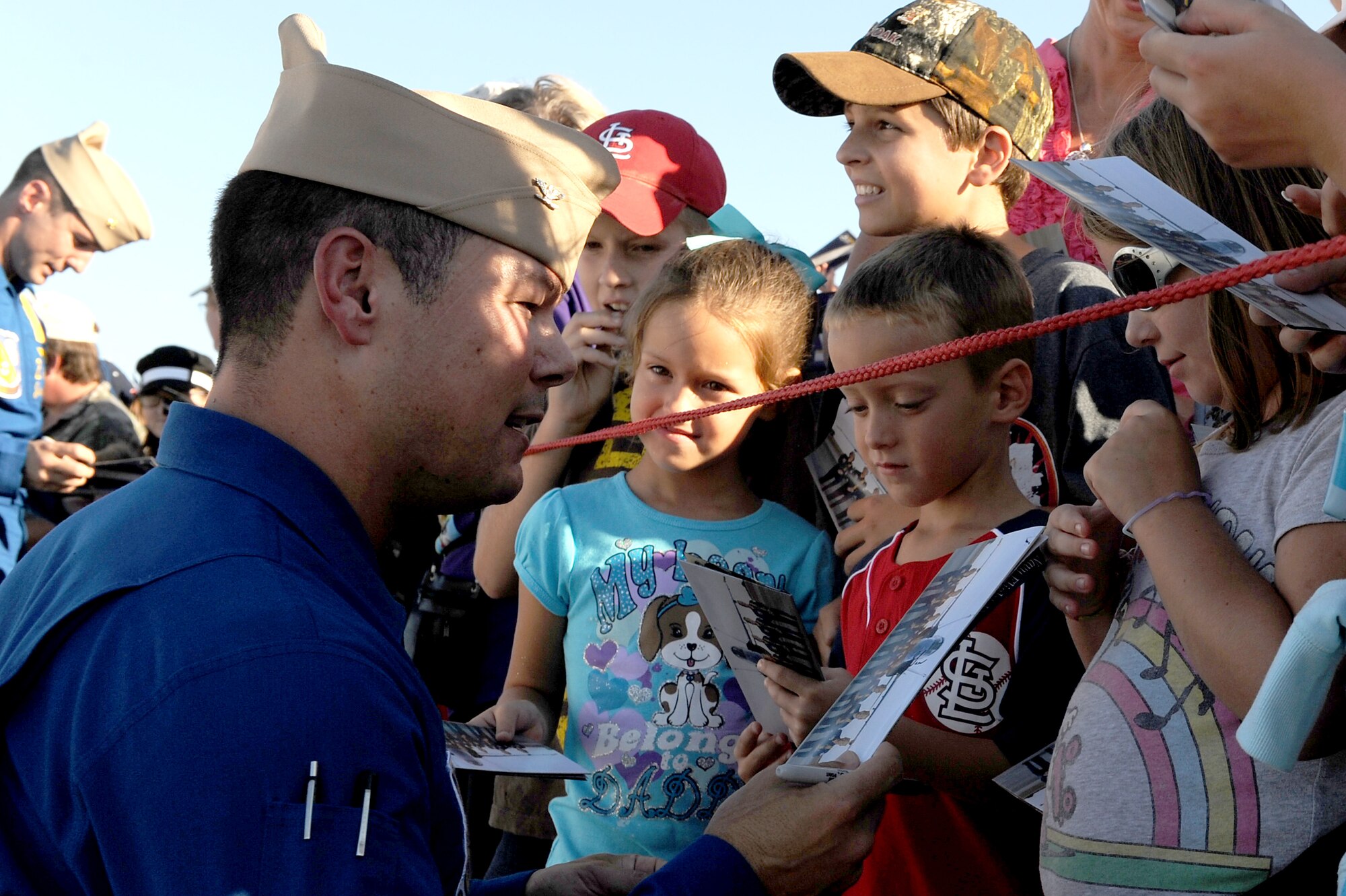 The Navy Blue Angels pilots take time to sign autographs and meet with the crowd after their performance during the 2010 Airpower Over the Midwest Air Show held Sept. 11 at Scott AFB. Other headlining acts included the Army Golden Knights Parachute Team and the Tora! Tora! Tora!, a reenactment of the Dec. 7, 1941 attack on Pearl Harbor with pyrotechnic explosions. (U.S. Air Force photo by Staff Sgt. Brian J. Valencia)