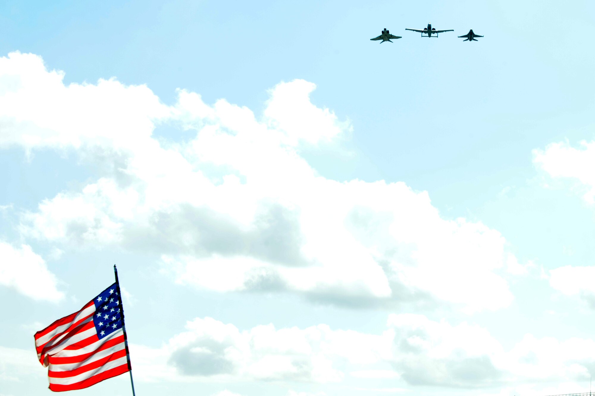 An A-10 Thunderbolt, F-4 Phantom, and F-16 Fighting Falcon pass over Scott AFB in a heritage flight during the 2010 Airpower Over the Midwest Air Show held Sept. 11. The event featured planes in the sky and planes on the ground along with many other displays showcasing military power from the past and present. (U.S. Air Force photo by Staff Sgt. Brian J. Valencia)