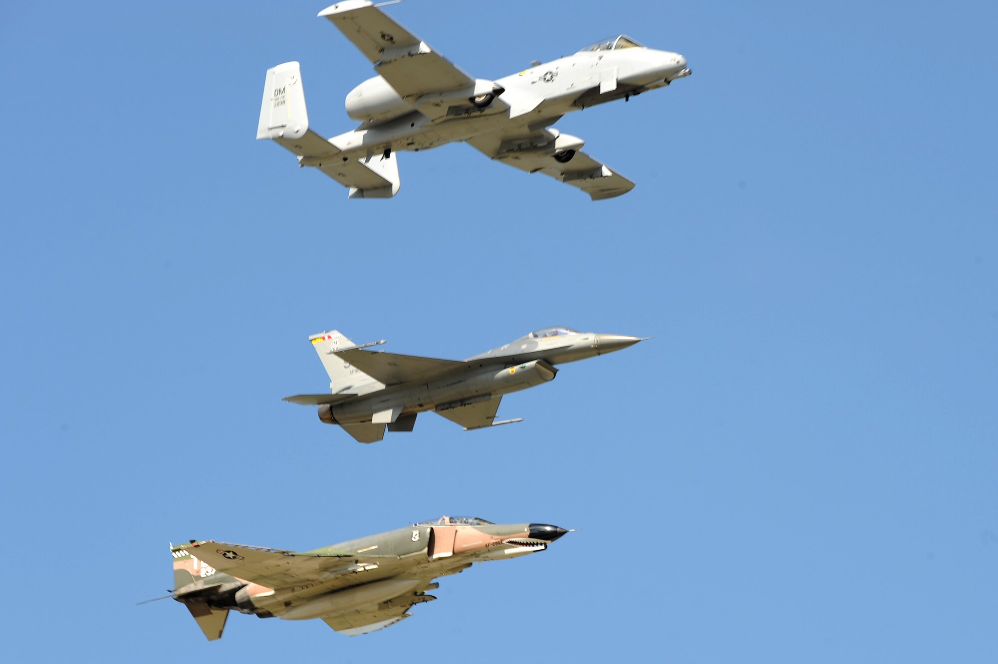 An A-10 Thunderbolt, F-4 Phantom, and F-16 Fighting Falcon pass over Scott AFB in a heritage flight during the 2010 Airpower Over the Midwest Air Show held Sept. 11. The event featured planes in the sky and planes on the ground along with many other displays showcasing military power from the past and present. (U.S. Air Force photo by Staff Sgt. Brian J. Valencia)