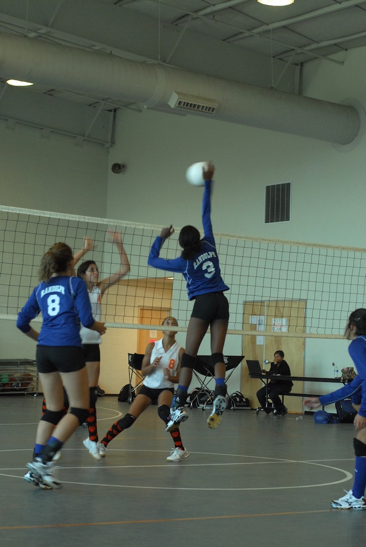 Randolph High School Ro-Hawks play Brooks Academy, beating them with a final score of 4-1. The Ro-Hawks are nealy unbeaten with a 6-1 record so far. Junior Jessica Waring blocking. (U.S. Air Force Photo/Brian McGloin)