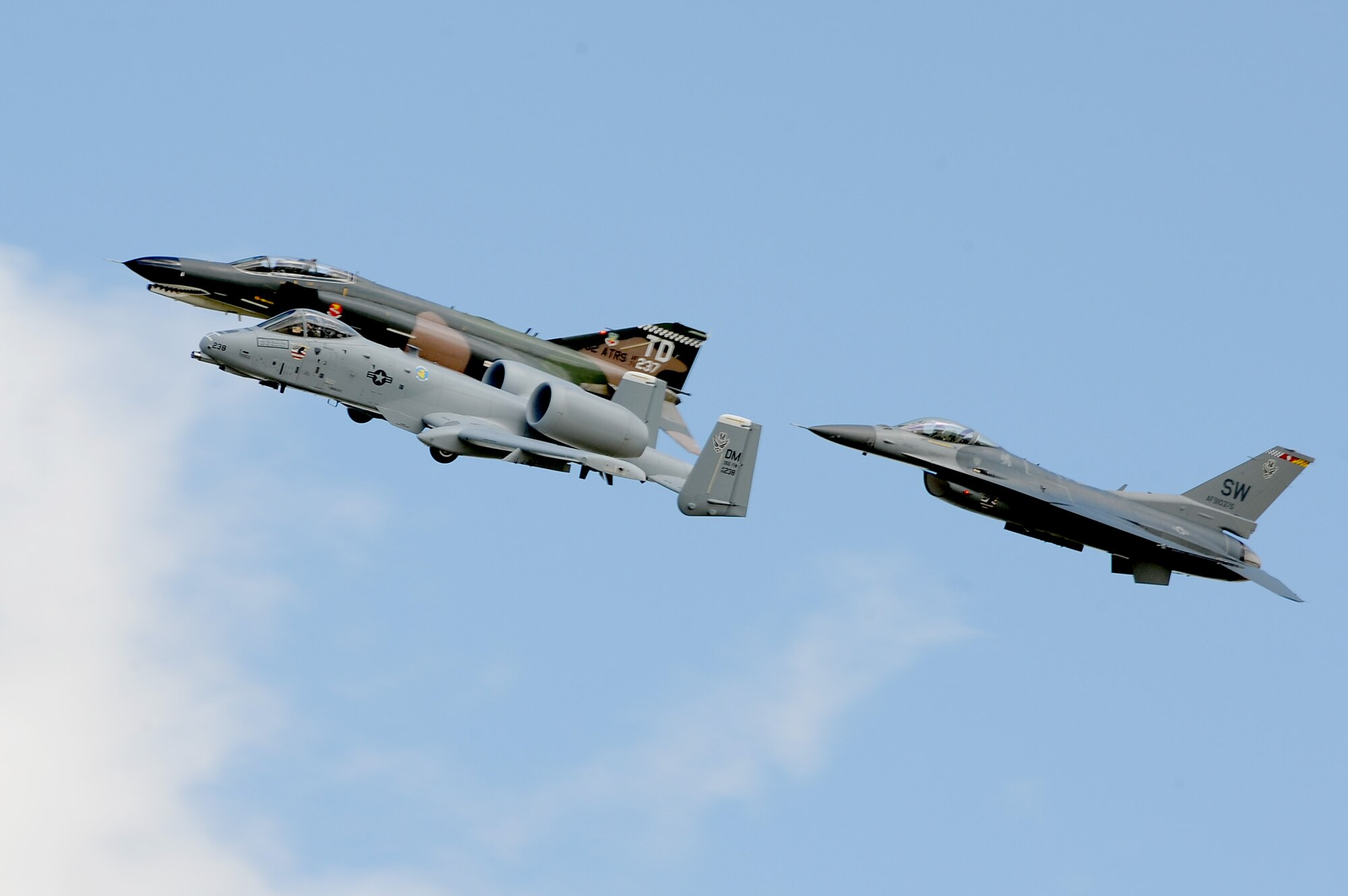 An A-10 Thunderbolt, F-4 Phantom, and F-16 Fighting Falcon pass over Scott AFB in a heritage flight during the 2010 Airpower Over the Midwest Air Show held Sept. 11. The event featured planes in the sky and planes on the ground along with many other displays showcasing military power from the past and present. (U.S. Air Force photo by Staff Sgt. Brian J. Valencia)