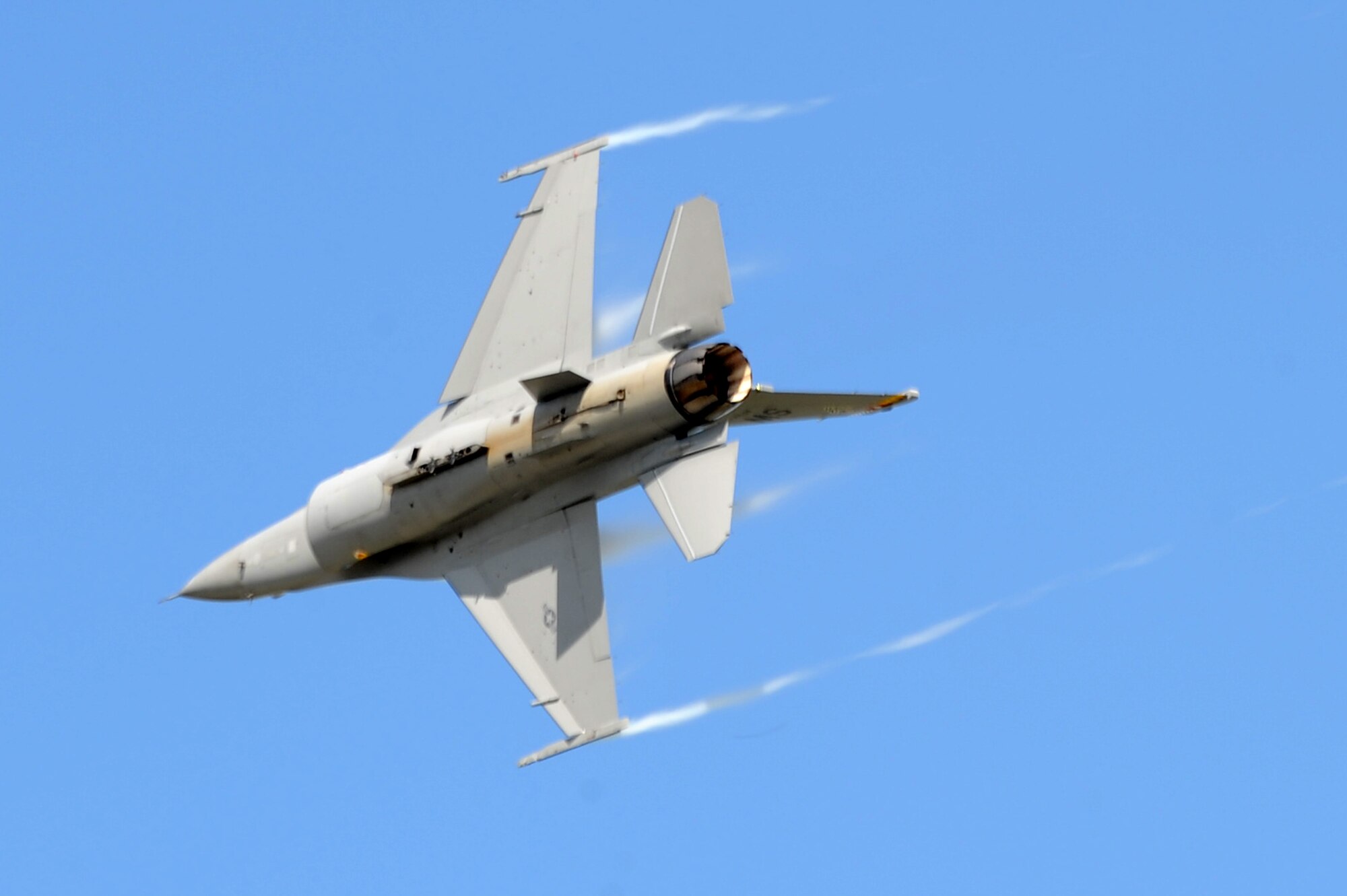 An F-16 Fighting Falcon makes a high speed pass over Scott AFB during the 2010 Airpower Over the Midwest Air Show held Sept. 11. The event featured planes in the sky and planes on the ground along with many other displays showcasing military power from the past and present. (U.S. Air Force photo by Staff Sgt. Brian J. Valencia)