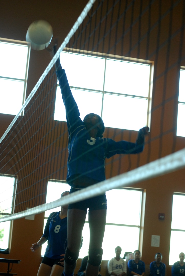 Randolph High School Ro-Hawks play Brooks Academy, beating them with a final score of 4-1. The Ro-Hawks are nealy unbeaten with a 6-1 record so far. Junior Jessica Waring at the net. (U.S. Air Force Photo/Brian McGloin)