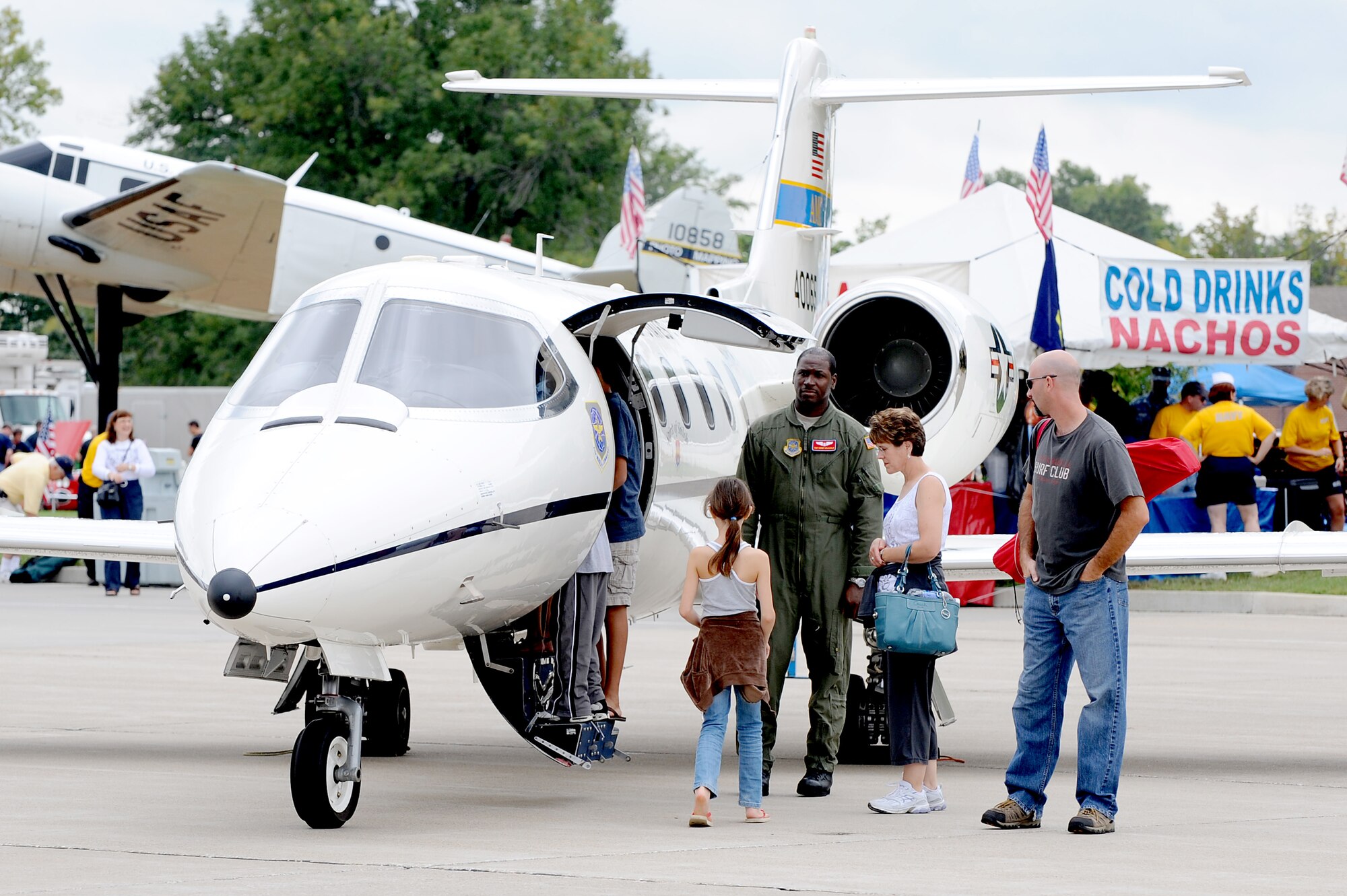 People explore a C-21 static display at the 2010 Airpower Over the Midwest Air Show held Sept. 11 at Scott AFB. The event featured planes in the sky and planes on the ground along with many other displays showcasing military power from the past and present. (U.S. Air Force photo by Staff Sgt. Brian J. Valencia)