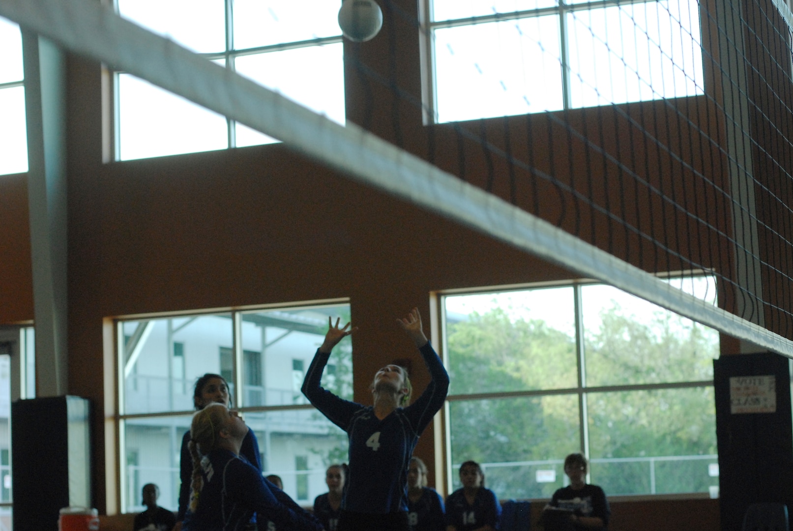 Randolph High School Ro-Hawks play Brooks Academy, beating them with a final score of 4-1. The Ro-Hawks are nealy unbeaten with a 6-1 record so far. Sophmore Natalie Nowland sets up a kill. (U.S. Air Force Photo/Brian McGloin)