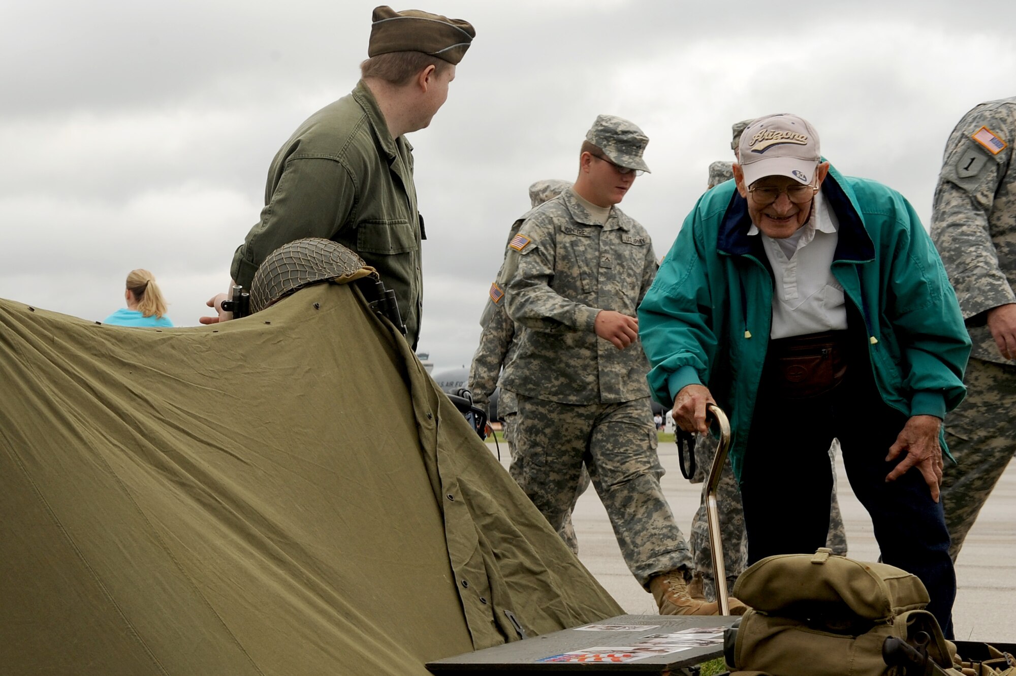 An elderly man looks at a display of World War II reenactor gear at the 2010 Airpower Over the Midwest Air Show held Sept. 11 at Scott AFB. The event featured planes in the sky and planes on the ground along with many other displays showcasing military power from the past and present. (U.S. Air Force photo by Staff Sgt. Brian J. Valencia)