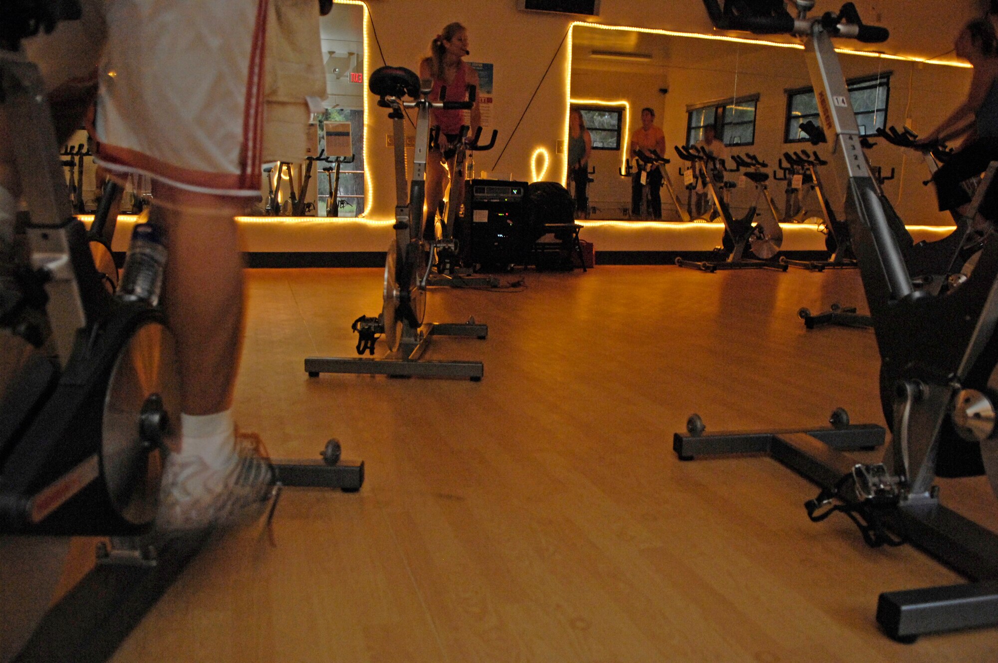 VANDENBERG AIR FORCE BASE, Calif. – Instructing an indoor cycling class at the fitness center annex here, Francine Ladd, a fitness instructor, motivates members of the class Tuesday, Sept. 14, 2010. Ms. Ladd is a contracted fitness instructor who provides safe and effective exercises for all her participants regardless of their fitness level. (U.S. Air Force photo/Airman 1st Class Lael Huss)