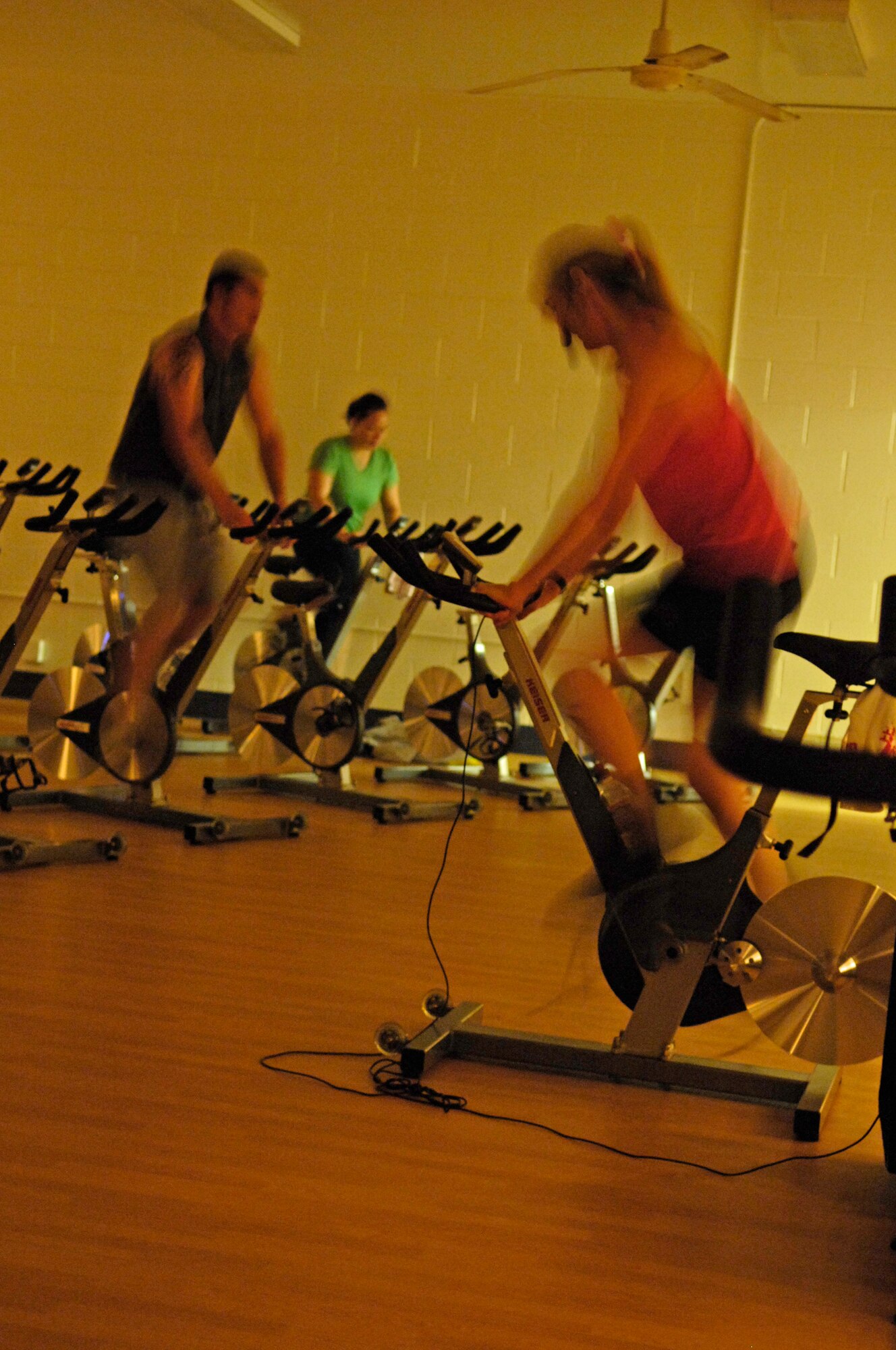 VANDENBERG AIR FORCE BASE, Calif. – In a slightly elevated position, Francine Ladd, a fitness instructor, leads an indoor cycling class at the fitness center annex here Tuesday, Sept. 14, 2010. The fitness center annex holds a number of fitness classes at the base to help people achieve their personal best guided by certified fitness professionals who provide safe and effective exercises for all participants. (U.S. Air Force photo/Airman 1st Class Lael Huss)