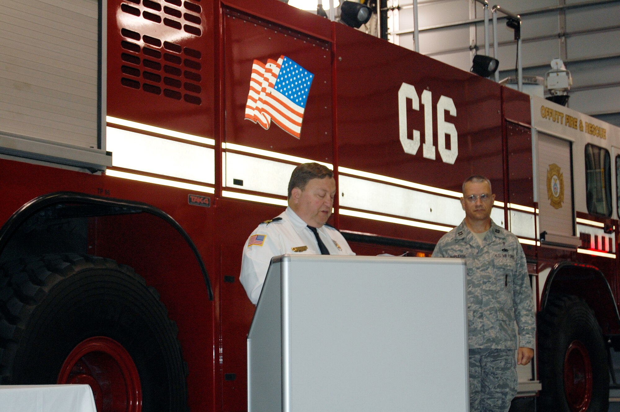 OFFUTT AIR FORCE BASE, Neb. - Fire Chief David Eblin explains the significance of  Offutt Fire Department's 9/11 Remembrance Ceremony Sept. 10 in the bay of the fire station. The annual ceremony, held during morning roll call, included the final alarm given to honor firefighters who have lost their lives in the line of duty. According to Station Chief Roger Filter, the tradition of the final alarm, consiting of two sets of five bell rings, dates back to the days of horse and buggy firefighters when alarm boxes were located around cities so people could notify fire departments of fires. They were also used  to notify citizens of the death of a firefighter.  U.S. Air Force photo by Debbie Aragon