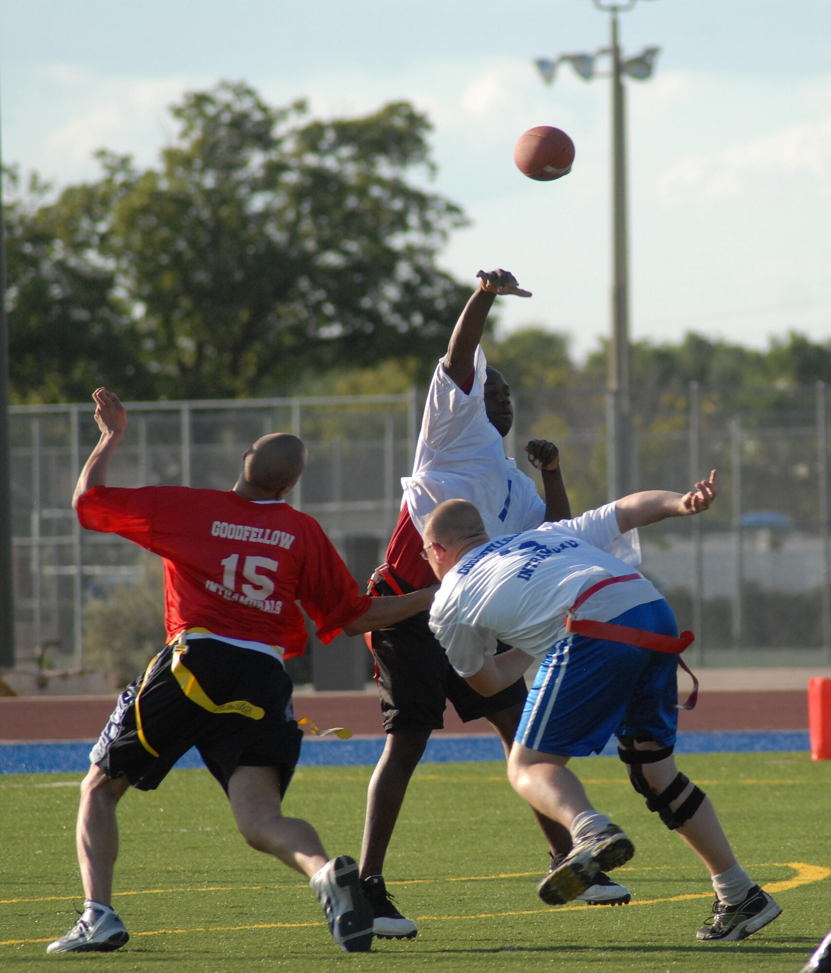 Michael Givan, 1st Responders quarterback, throws one down field thanks to a block by a fellow teammate during an intramural game against the 17th Medical Group Cobras Sept. 13. 1st Responders defeated the Cobras 21-20. (U.S. Air Force photo/Connie Hempel)