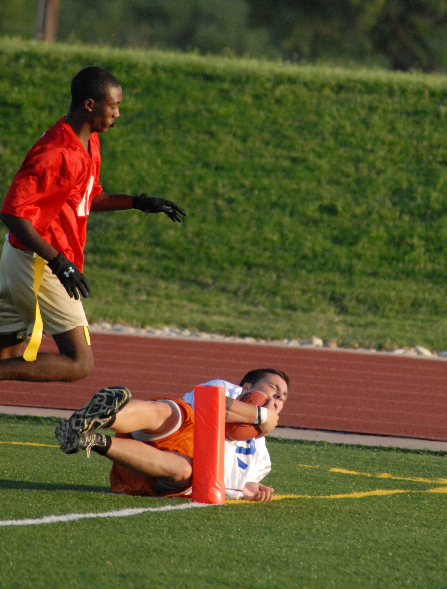 Matthew Riddle sneaks one in for a 1st Responders touchdown during an intramural game against the 17th Medical Group Cobras Sept. 13. 1st Responders defeated the Cobras 21-20. (U.S. Air Force photo/Connie Hempel)