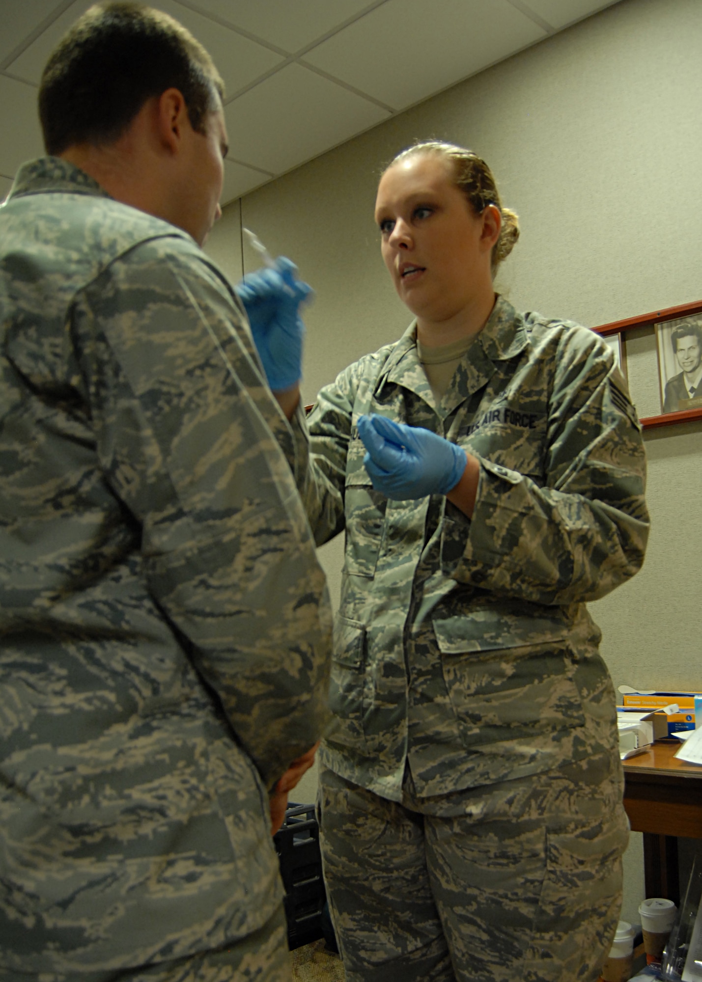 GOODFELLOW AIR FORCE BASE, Texas -- Senior Airman Lacy Hull, 17th Medical Operations Squadron gives a FluMist to 2nd Lt. Adam Harper, 315th Training Squadron intelligence student, during a visit to the headquarters building Sept. 14. The 17 MDOS provided flu vaccines as part of a early kick off for the 2010 flu season, which runs Oct. through March 2011. (U.S. Air Force photo/ Senior Airman Tong Duong) 