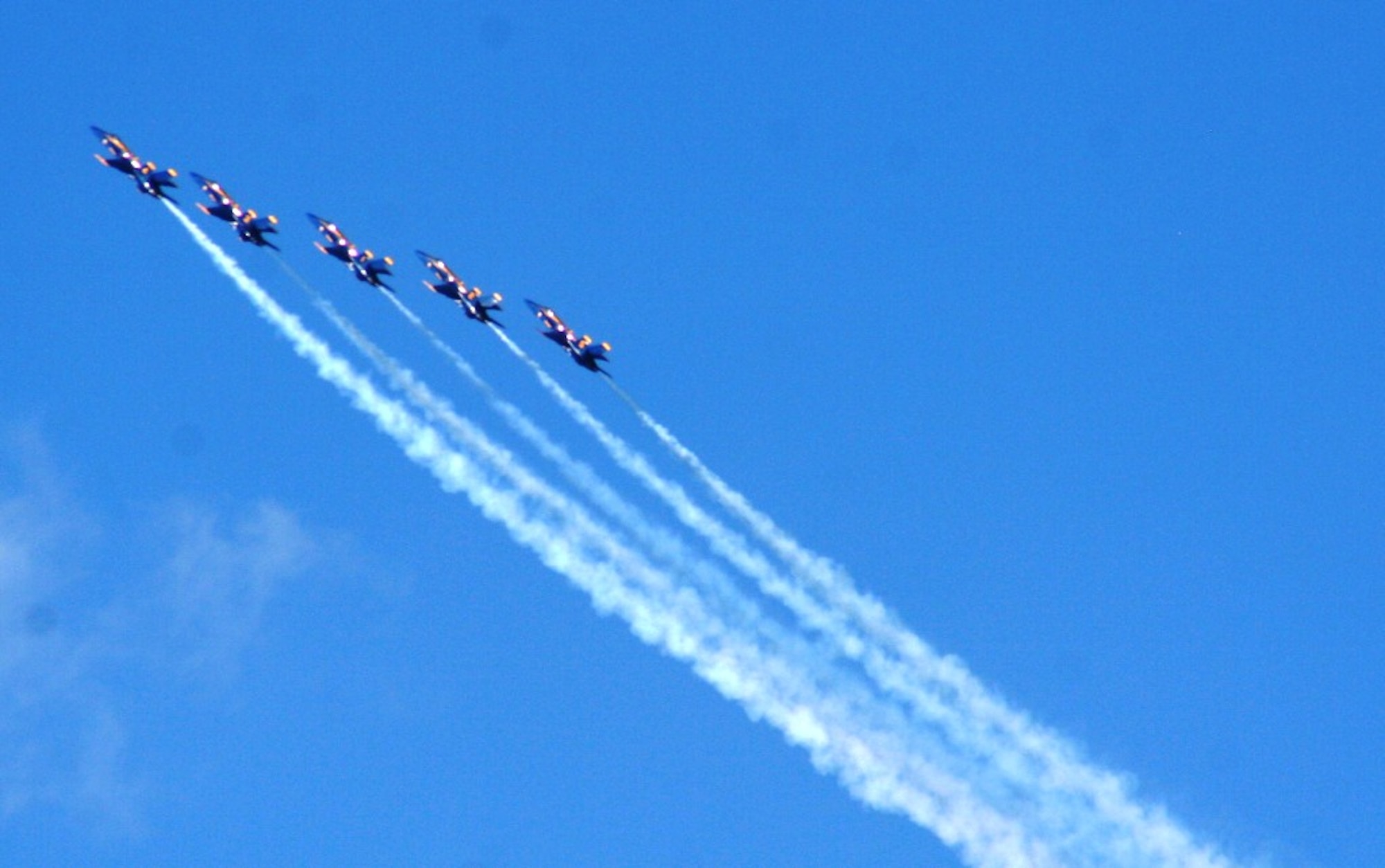 The U.S. Navy's Blue Angels aerial demonstration team performs during the 2010 Airpower Over The Midwest Airshow on Sept. 11, 2010, at Scott Air Force Base, Ill. Tens of thousands of people attended the two-day airshow. (U.S. Air Force Photo/Master Sgt. Scott T. Sturkol)
