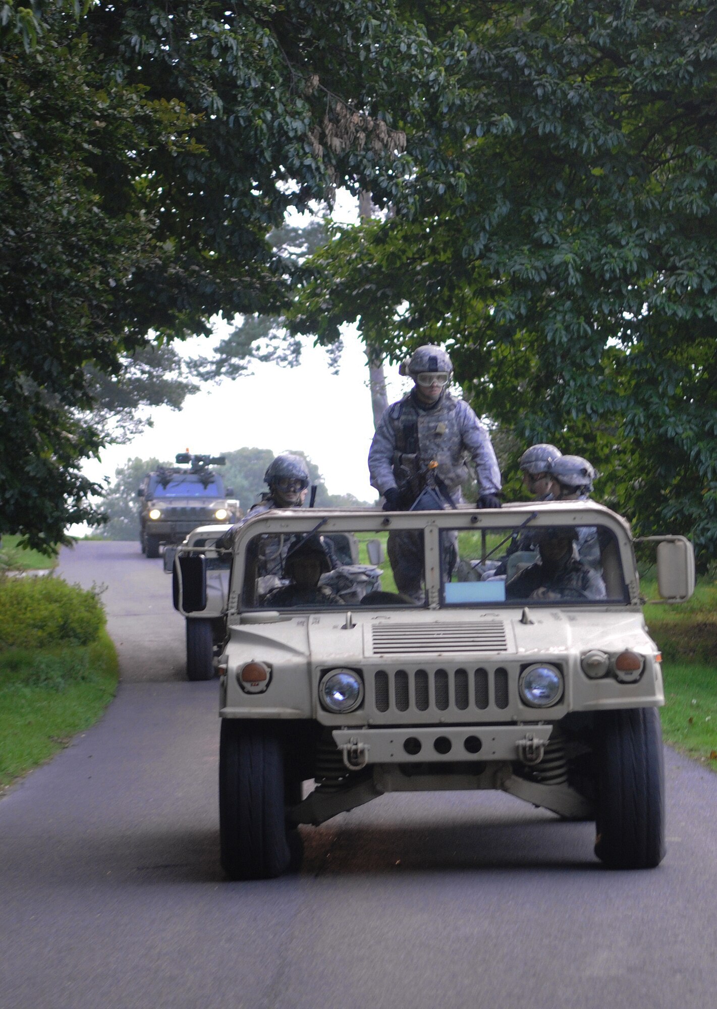 STANFORD TRAINING AREA, England -- Members of the 100th Security Forces Squadron convoy with Royal Air Force Regiment servicemembers to conduct a key leadership engagement training mission in a nearby mock Afghan village Sept. 9. The British forces were conducting their last training scenarios before deploying to Afghanistan. More than 20 U.S. Airmen embedded into the training to fill the place of U.S. Marines that the British force would be working side by side with on their deployment. (U.S. Air Force photo/Staff Sgt. Thomas Trower) 