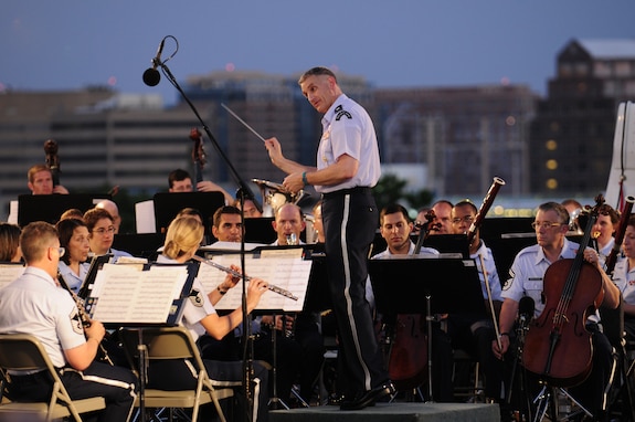 Lt. Col. A. Phillip Waite, United States Air Force Band commander, conducts the Air Force Band’s Concert Band during his first public concert June 18. The Band’s six performing ensembles take turns performing throughout the summer at the Air Force Memorial each Wednesday and Friday with no fee for attendance. Lt. Col. A. Phillip Waite assumed command of the Air Force Band in a change-of-command ceremony June 1. (U.S. Air Force photo by Staff Sgt. Raymond Mills)